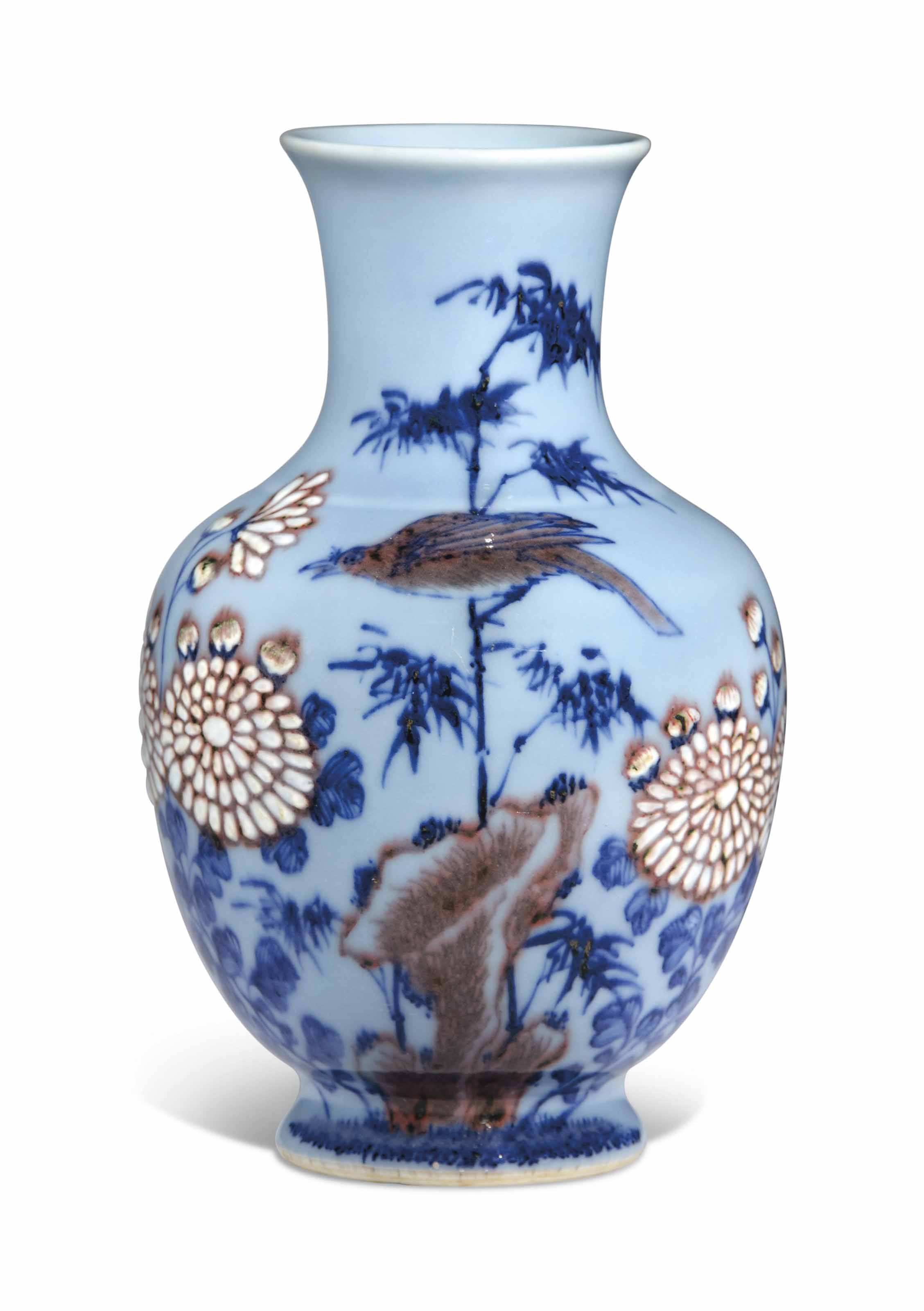 AN UNDERGLAZE BLUE AND COPPERREDDECORATED PALE BLUEGLAZED VASE