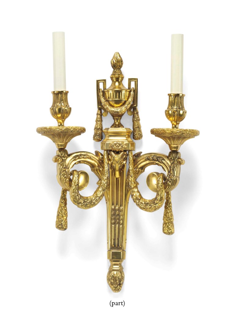 A SET OF FOUR GILTBRASS TWINLIGHT WALL APPLIQUES, IN THE STYLE OF