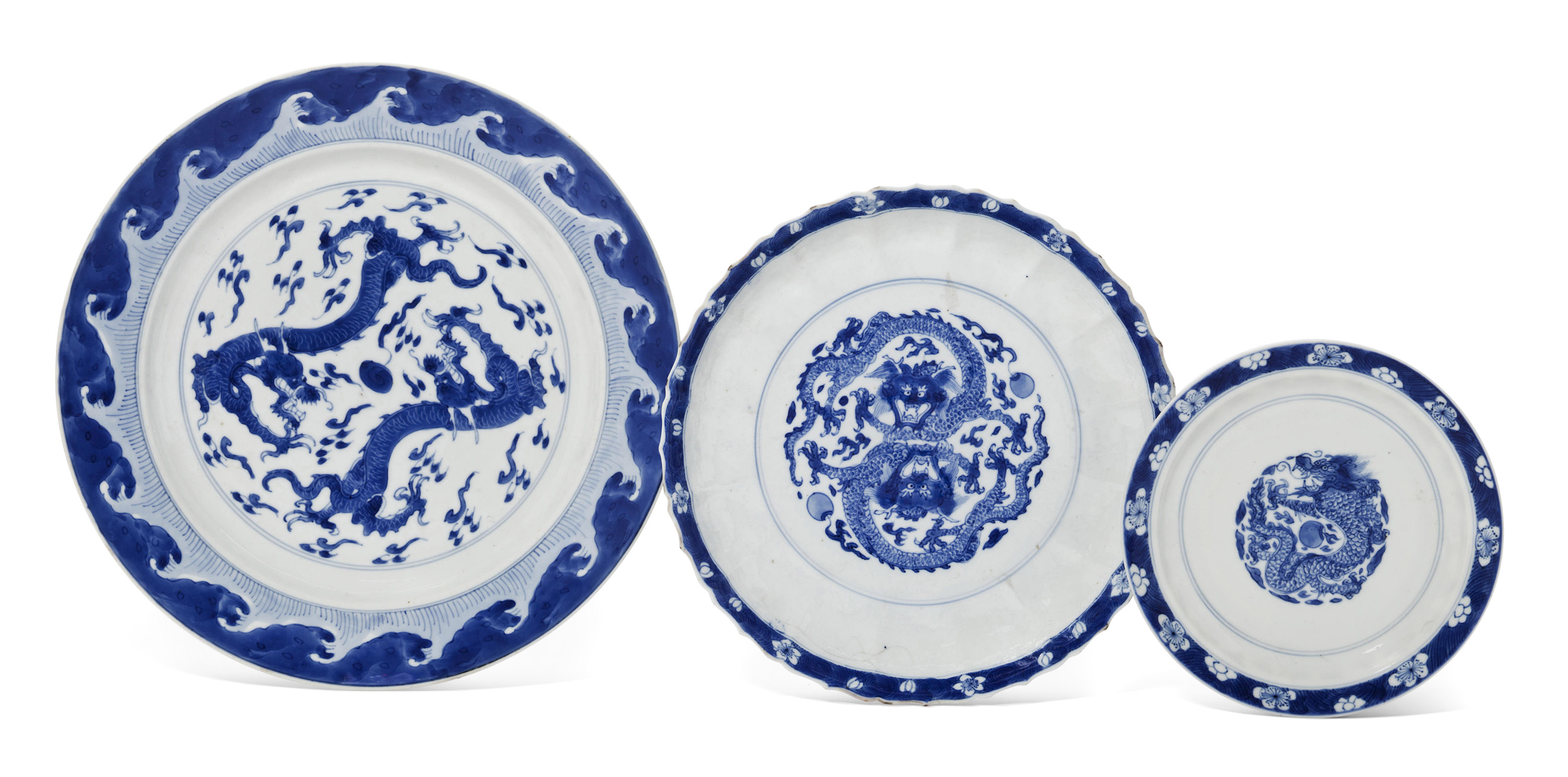 THREE BLUE AND WHITE 'DRAGON' DISHES, KANGXI PERIOD (16621722