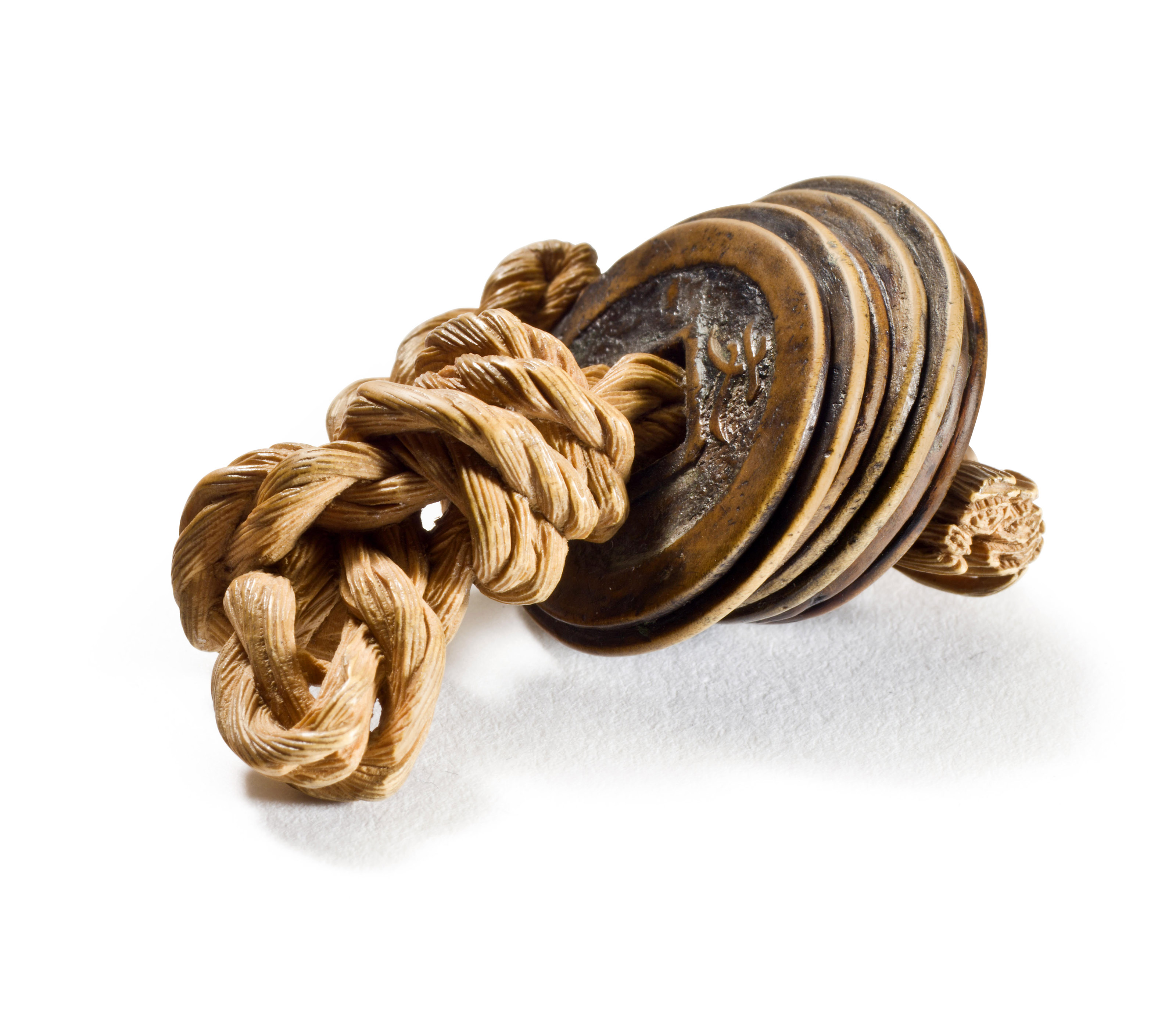 A CARVED WOOD NETSUKE OF A STRING OF COINS, SIGNED SOKO (MORITA SOKO ...