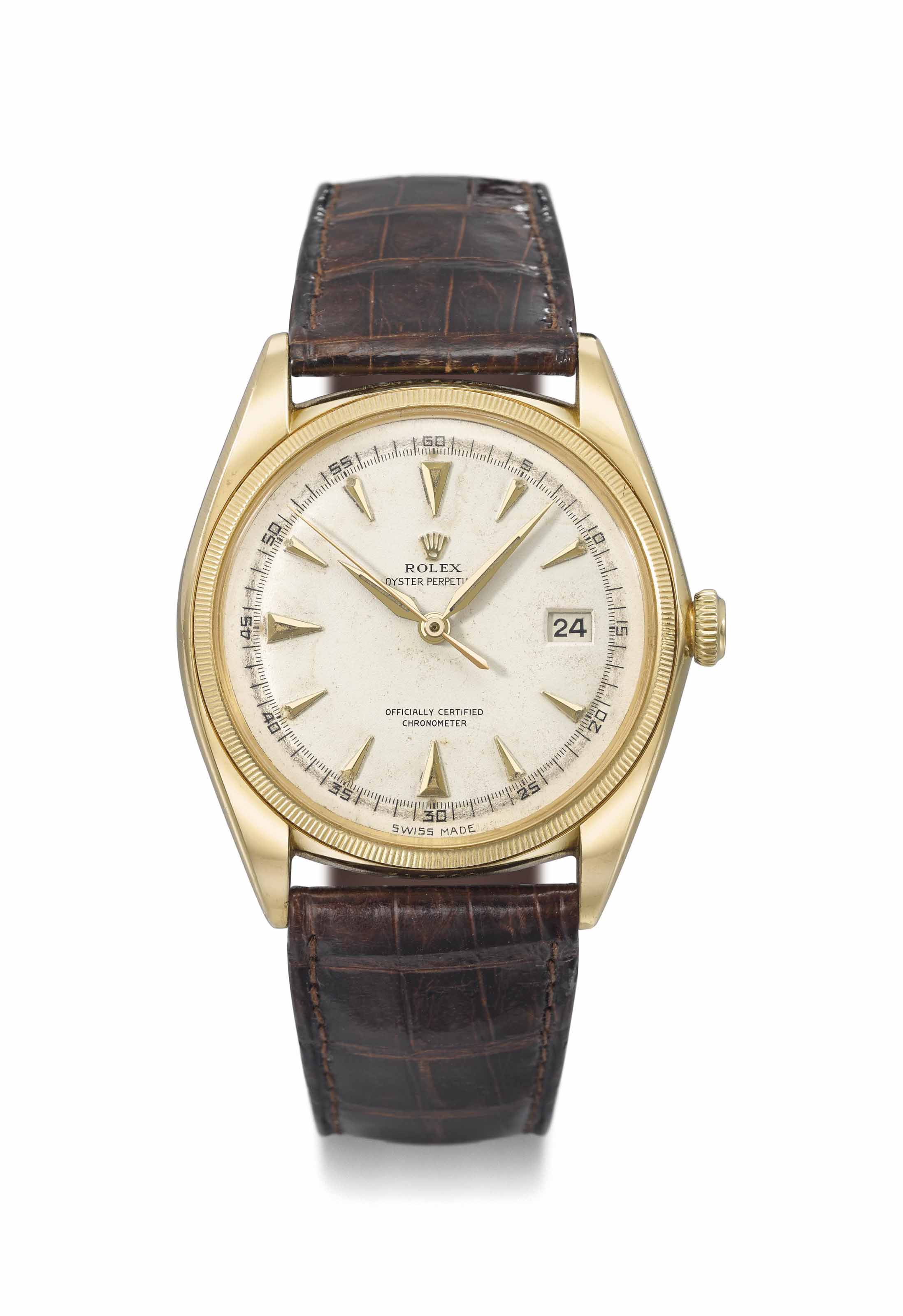 Rolex. An 18K gold automatic wristwatch with sweep centre seconds and date Signed Rolex Oyster Perpetual ref. 4467 case no. 518 500 manufactured in 1946 Christie s