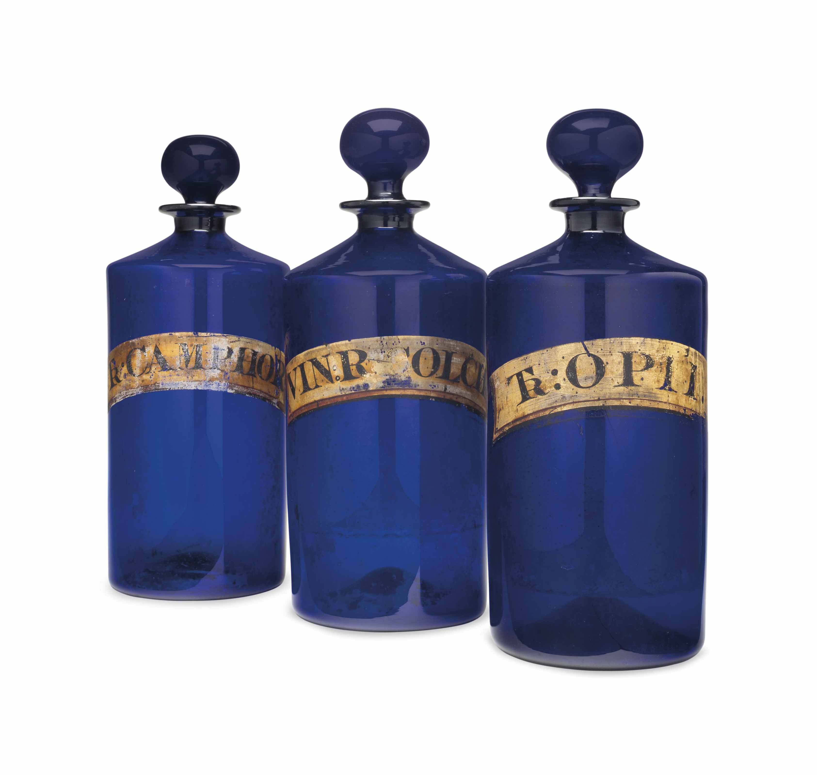 NINE LARGE COBALT BLUE GLASS APOTHECARY JARS AND COVERS , LATE 19TH