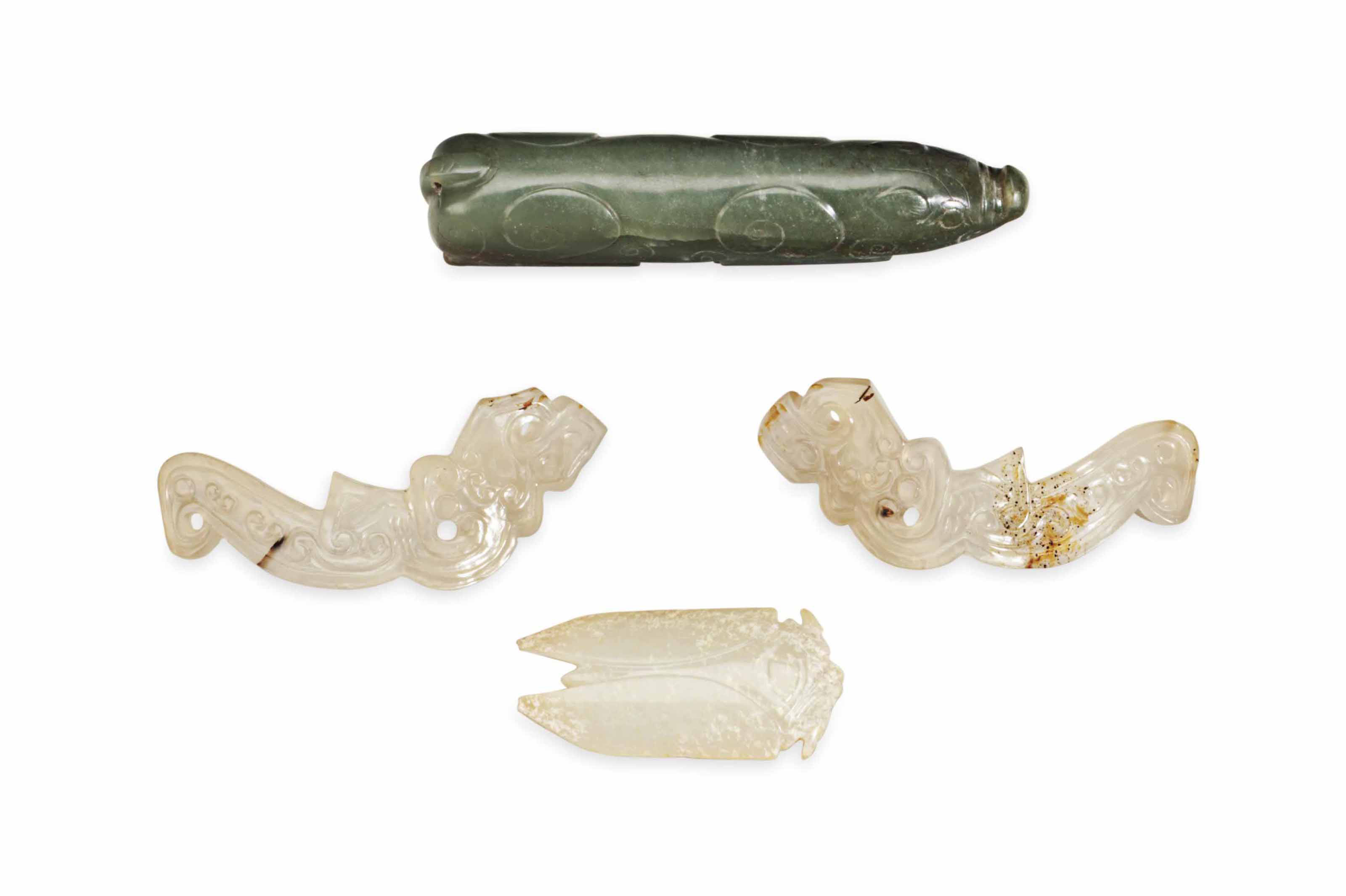 FOUR CHINESE ARCHAISTIC CARVED JADE OR STONE ORNAMENTS Christie's