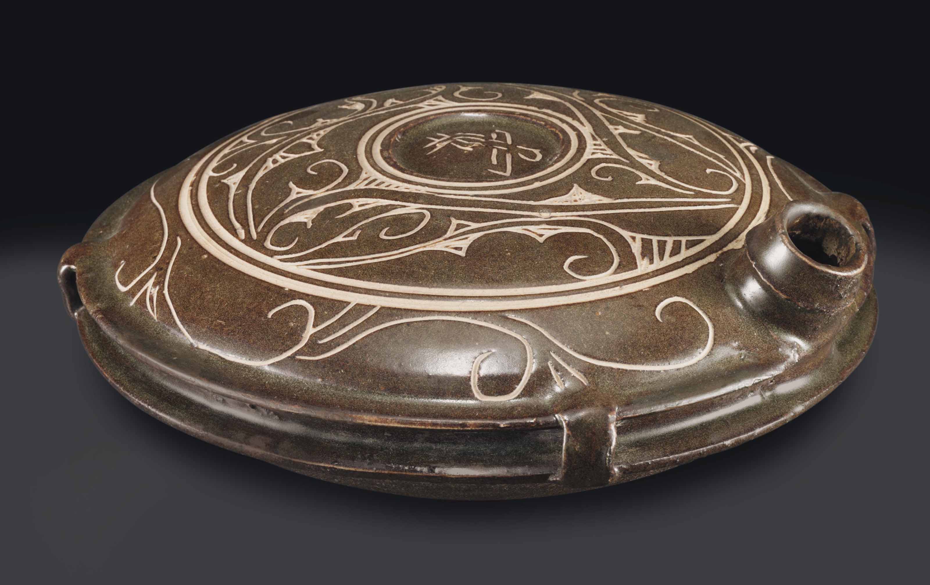 A RARE CIZHOU-TYPE CUT-GLAZE `TORTOISE-SHAPED CANTEEN , JIN-YUAN DYNASTY, 13TH CENTURY | Christies
