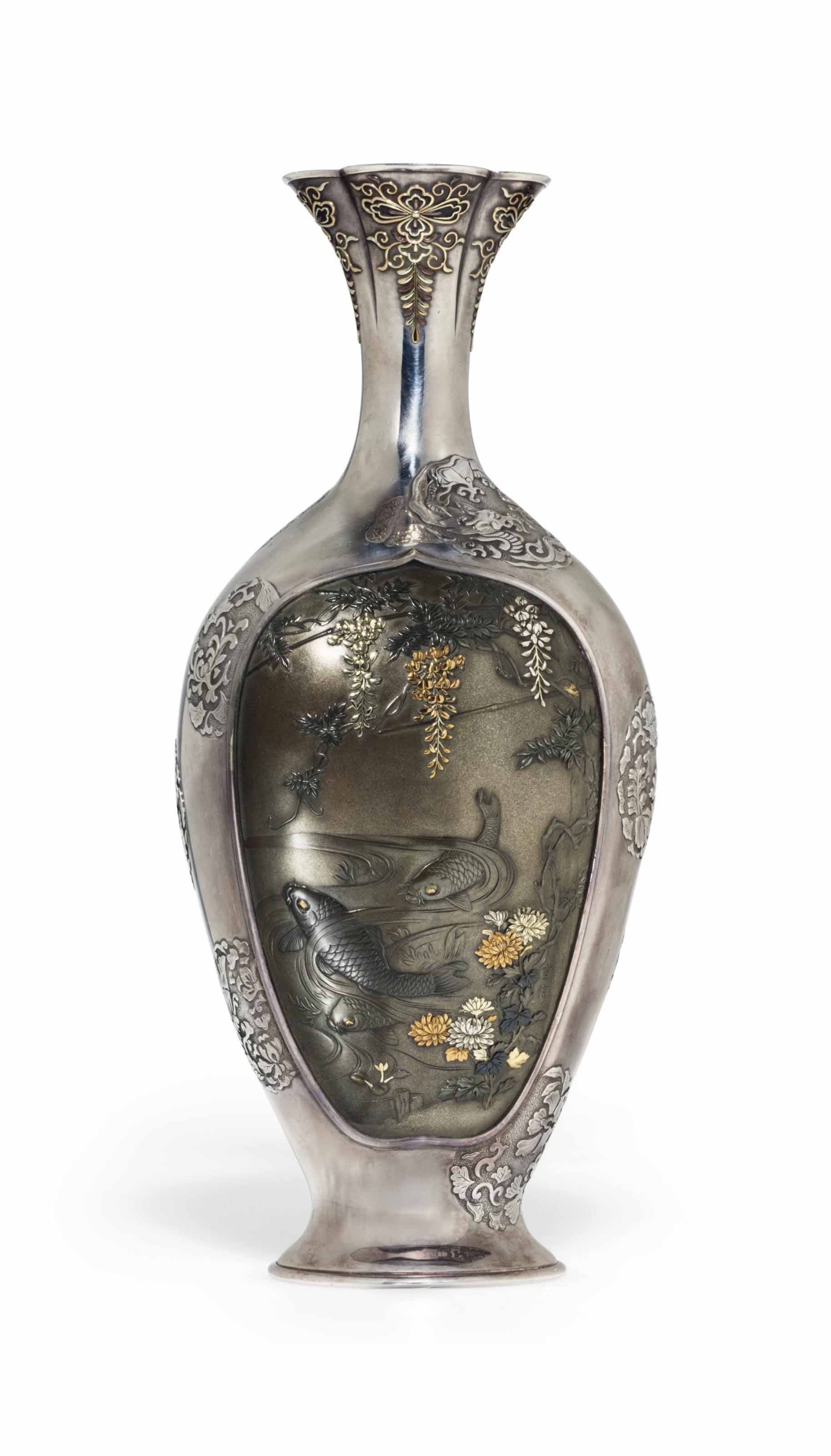 A mixed metal  inlaid silver vase 