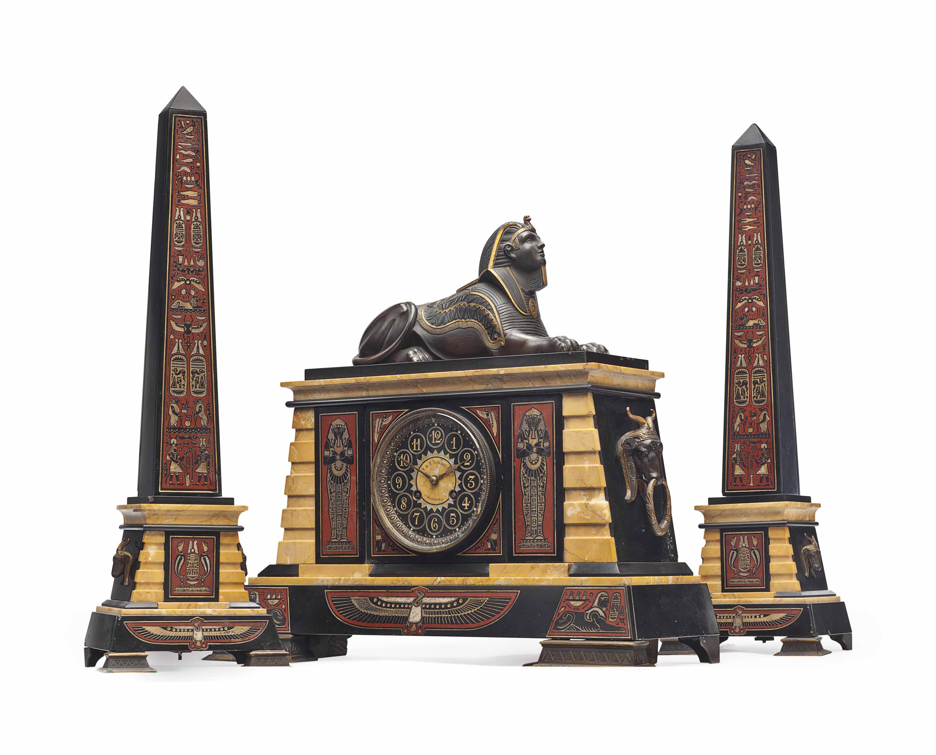 AN EGYPTIAN REVIVAL MARBLE, PATINATED AND GILTBRONZE THREEPIECE CLOCK