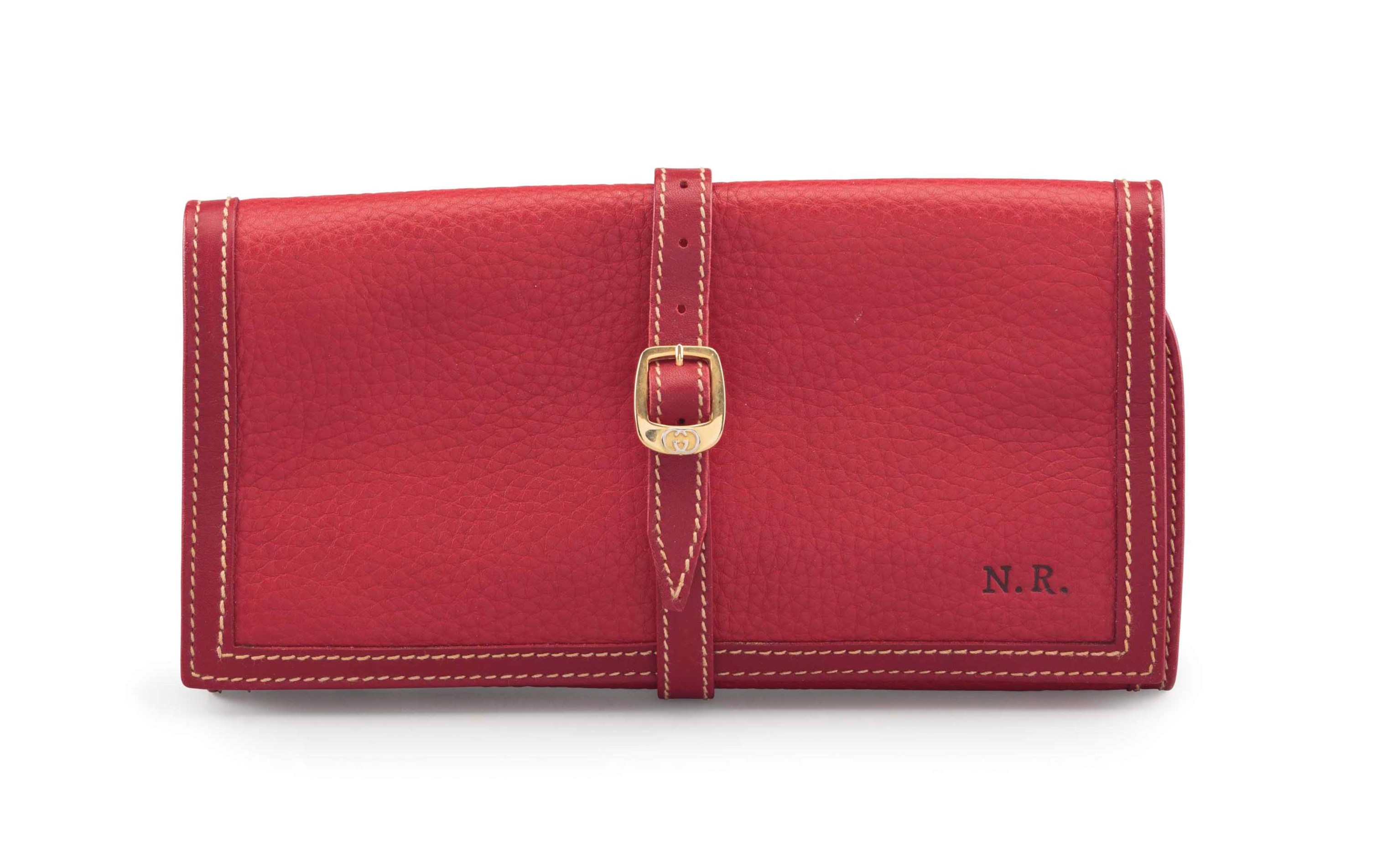 A MONOGRAMMED RED LEATHER JEWELRY ROLL CASE, GUCCI Christie's