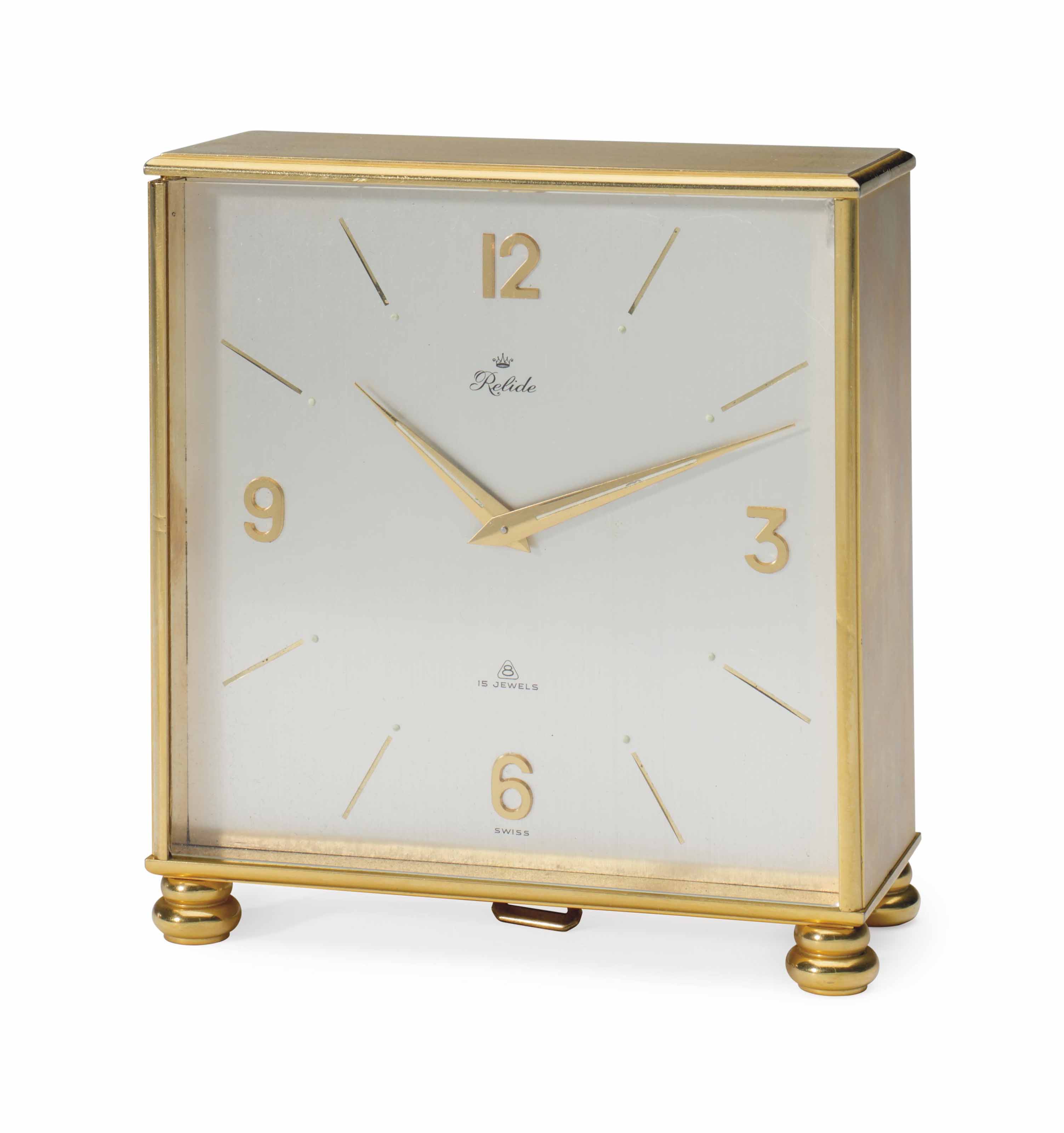 A SWISS BRASS 'DOUBLE FACE' DESK CLOCK , RETAILED BY RELIDE, CIRCA 1980