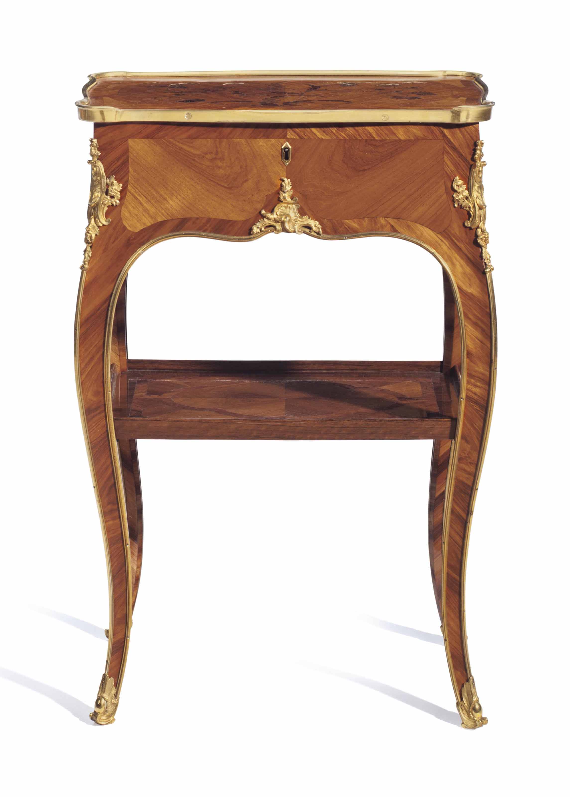 A Louis XV ormolu-mounted bois satine, tulipwood and amaranth bois de bout marquetry table en chiffonni&egrave;re, by Bernard II van Risenburgh, circa 1750. 26&frac12;  in (67.3  cm) high, 17&frac14;  in (43.8  cm) wide, 11&frac34;  in (29.8  cm) deep. Sold for $93,750 on 14-15 June 2016 at Christie&rsquo;s in New York