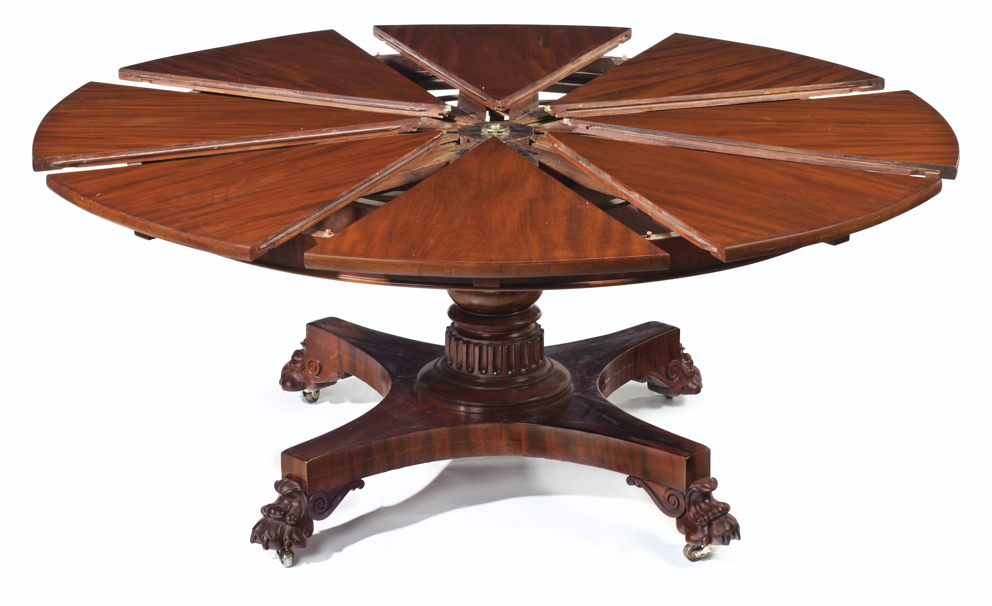A William Iv Mahogany Circular Extending Dining Table By