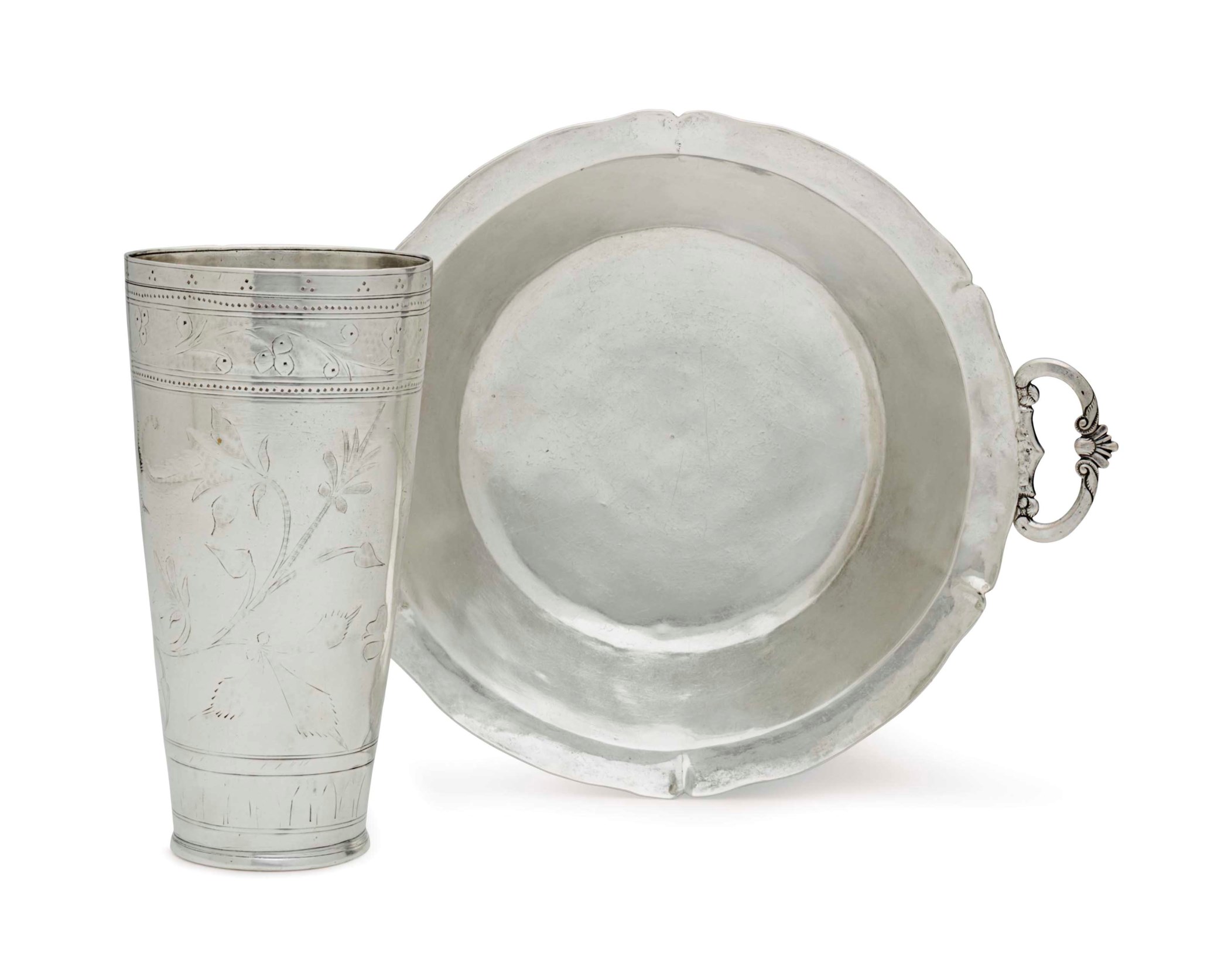 A SPANISH COLONIAL SILVER TWOHANDLED DISH AND A LARGE BEAKER, 18TH
