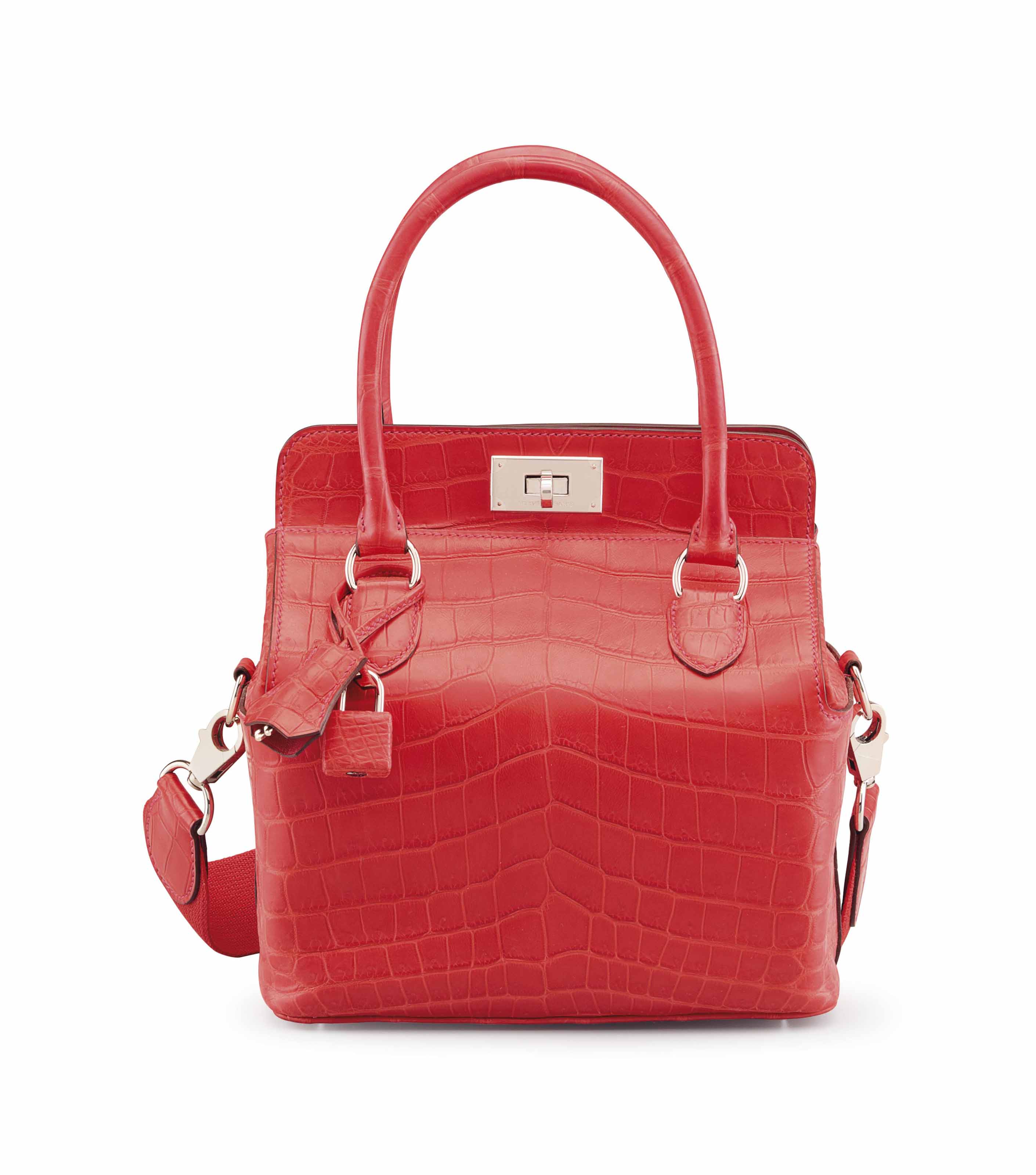 A COLVERT OSTRICH KELLY POCHETTE WITH GOLD HARDWARE