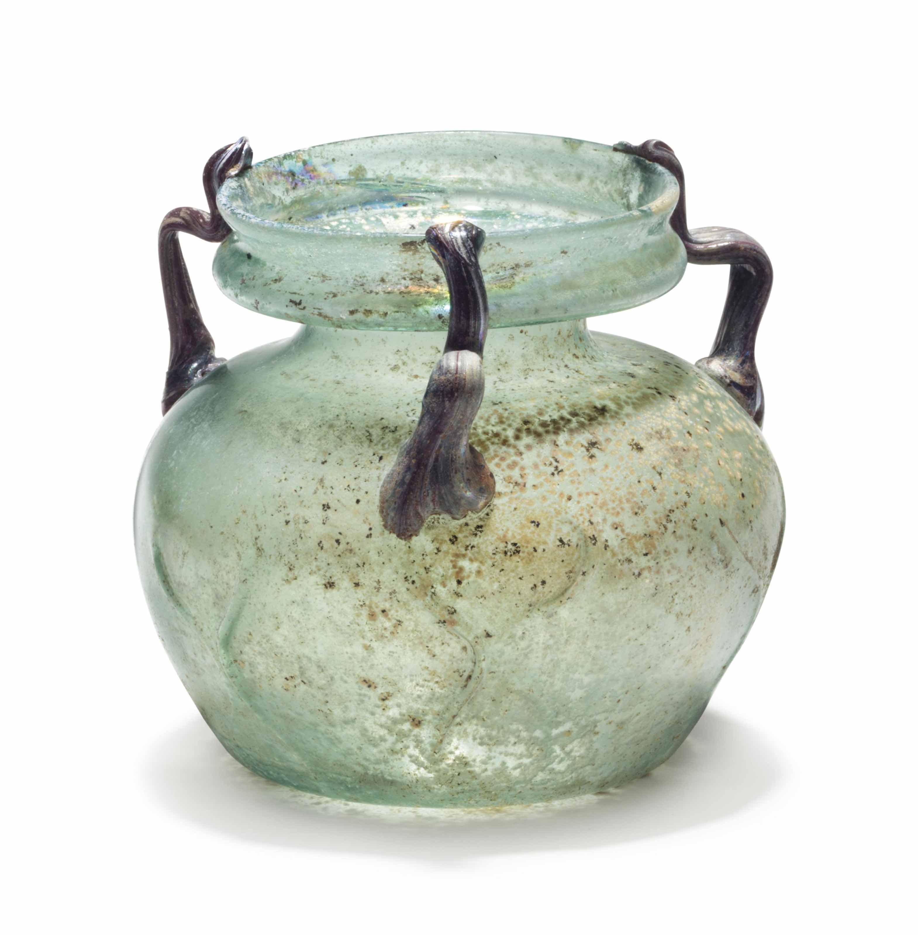 A LATE ROMAN GLASS THREEHANDLED JAR , CIRCA 4TH5TH CENTURY A.D