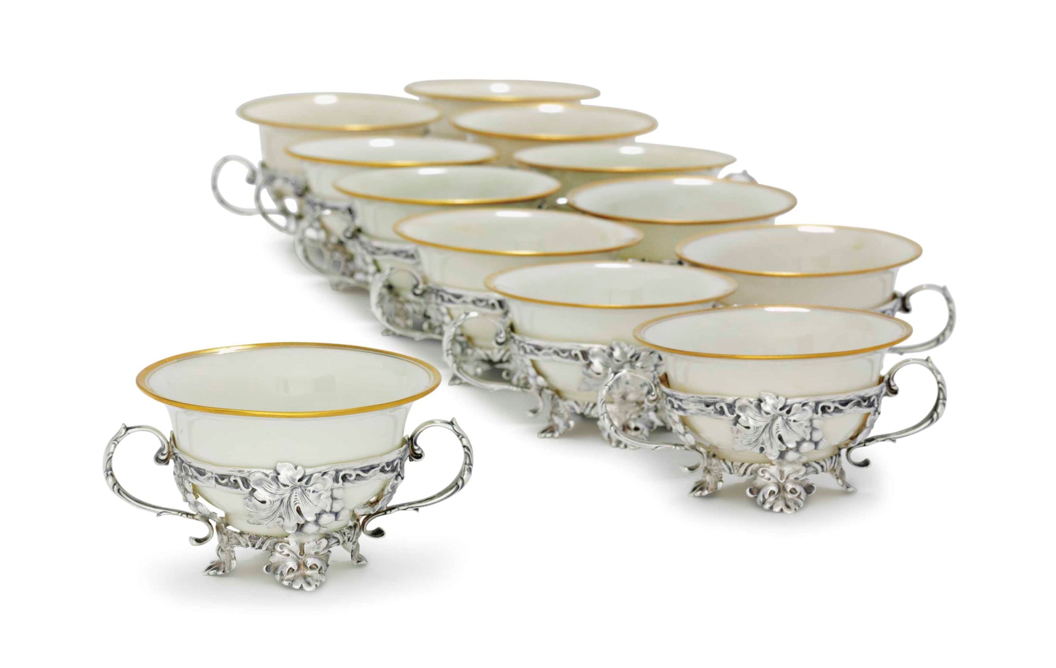 A SET OF TWELVE SILVER BOUILLON CUPS WITH PORCELAIN LINERS, AND TWO