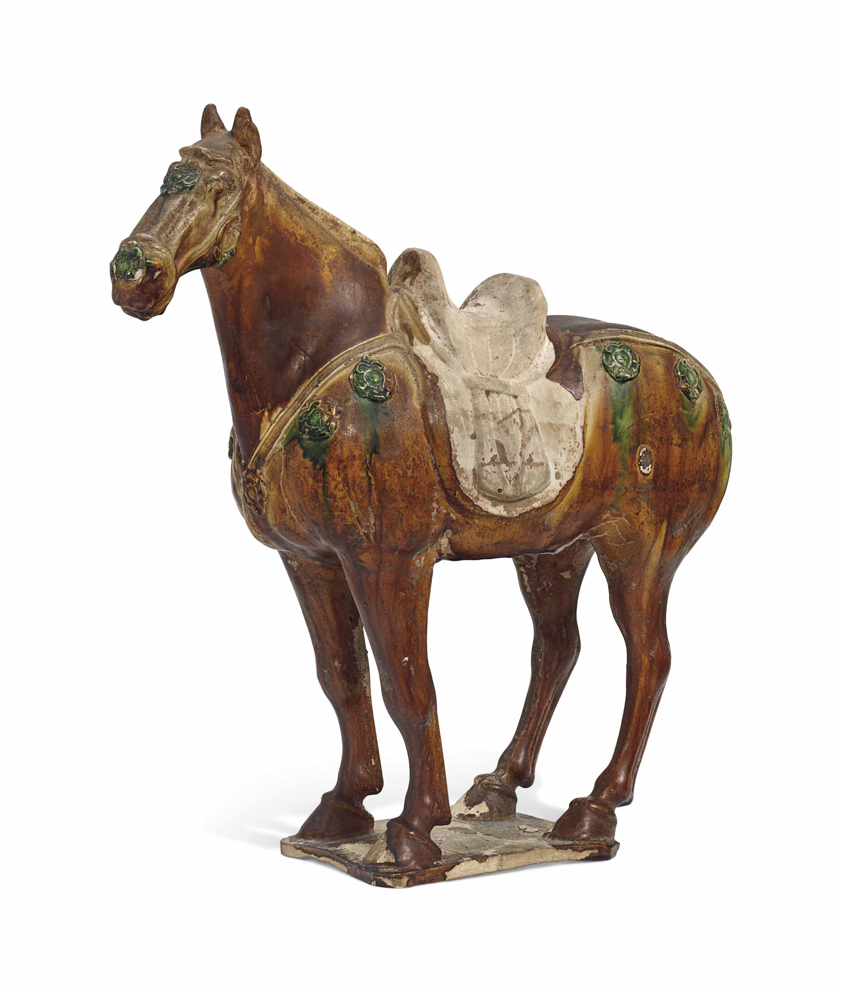 A SANCAI GLAZED POTTERY FIGURE OF A HORSE , TANG DYNASTY (AD 618907