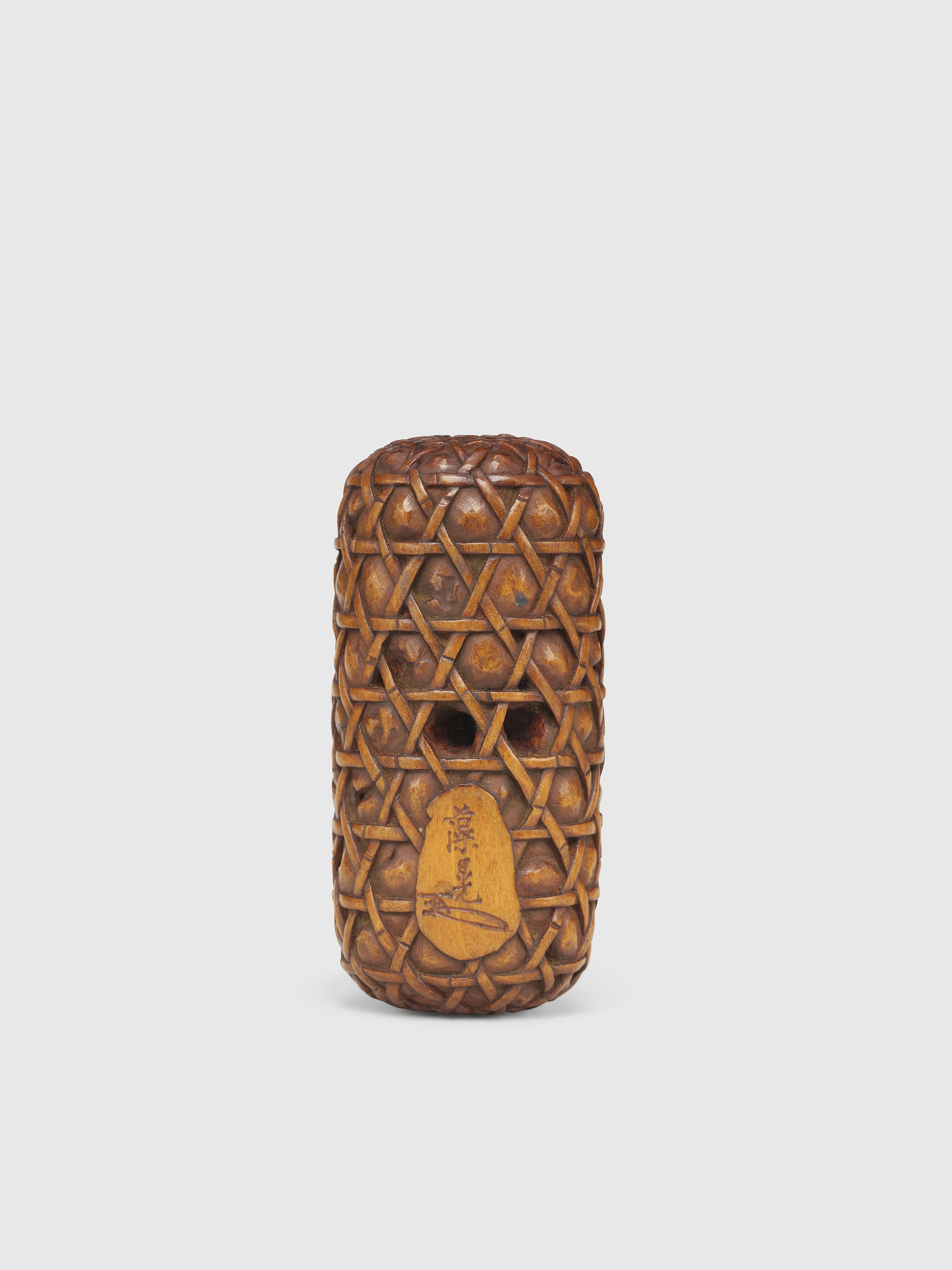 A WOOD NETSUKE OF A CRAB ON A JAKUGO, SIGNED SOKO AND KAKIHAN