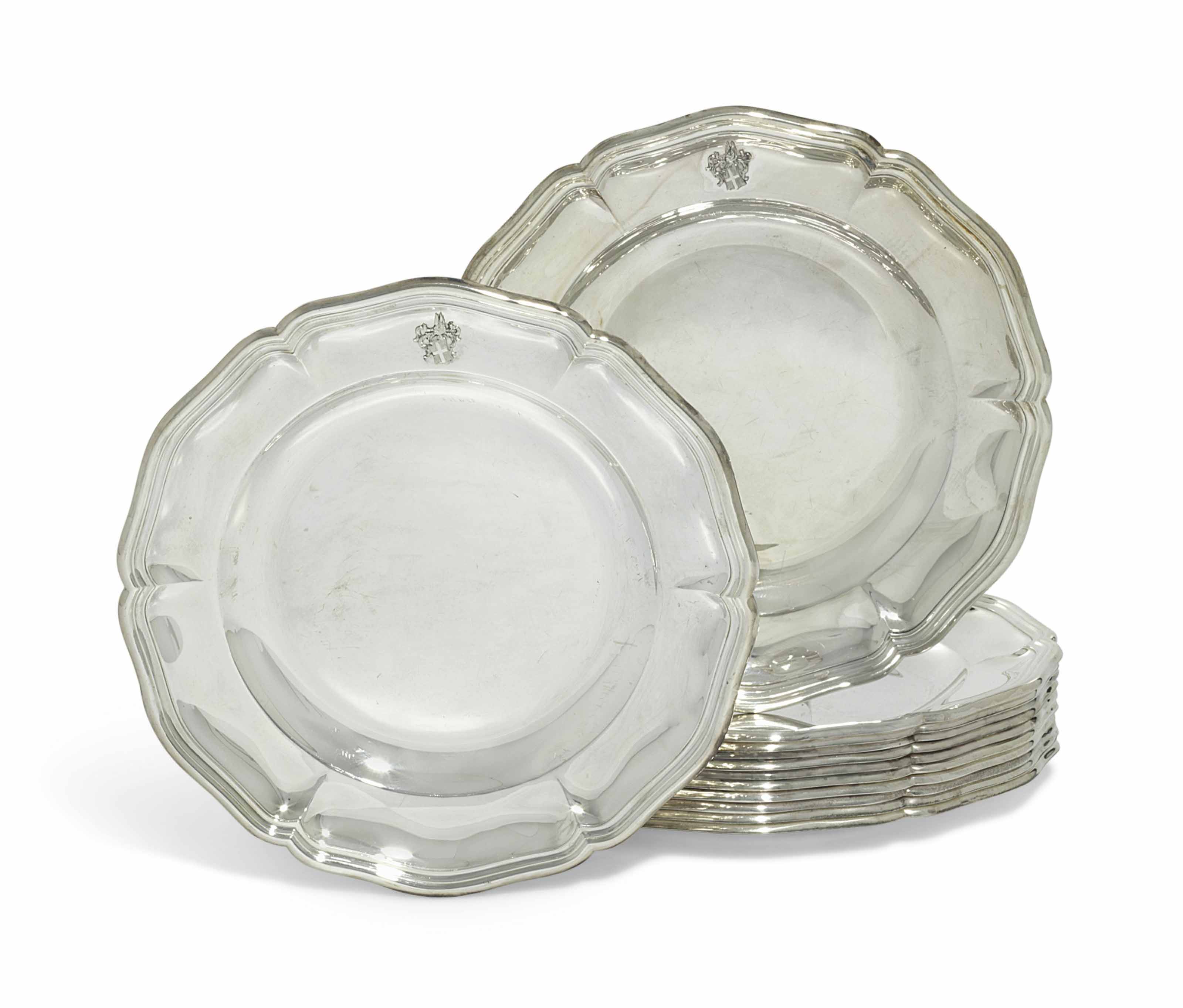 A SET OF TWELVE ITALIAN SILVER DINNERPLATES , RETAILED BY A. TAZZETTI