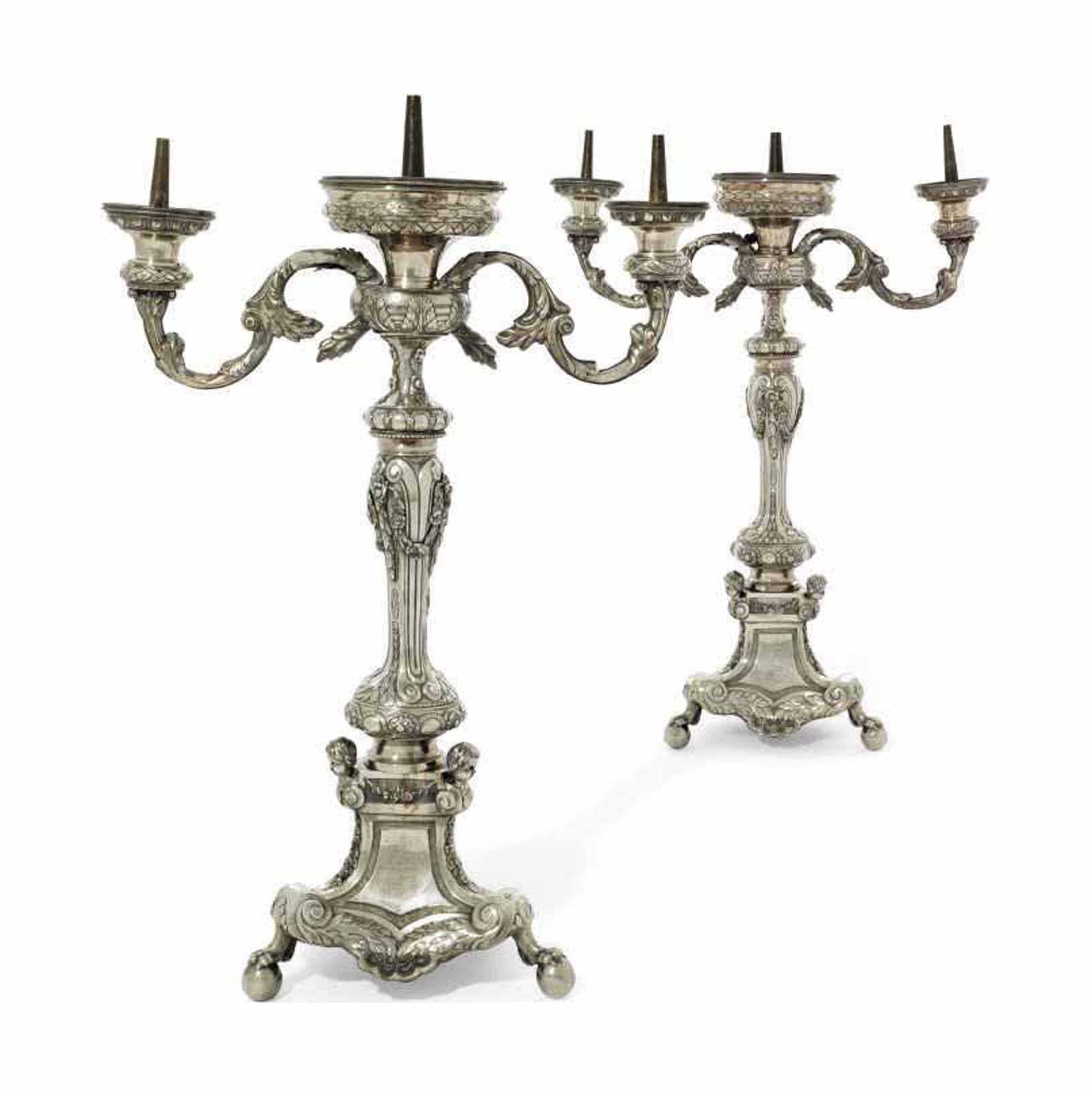 A PAIR OF THREELIGHT ALTARCANDELABRA