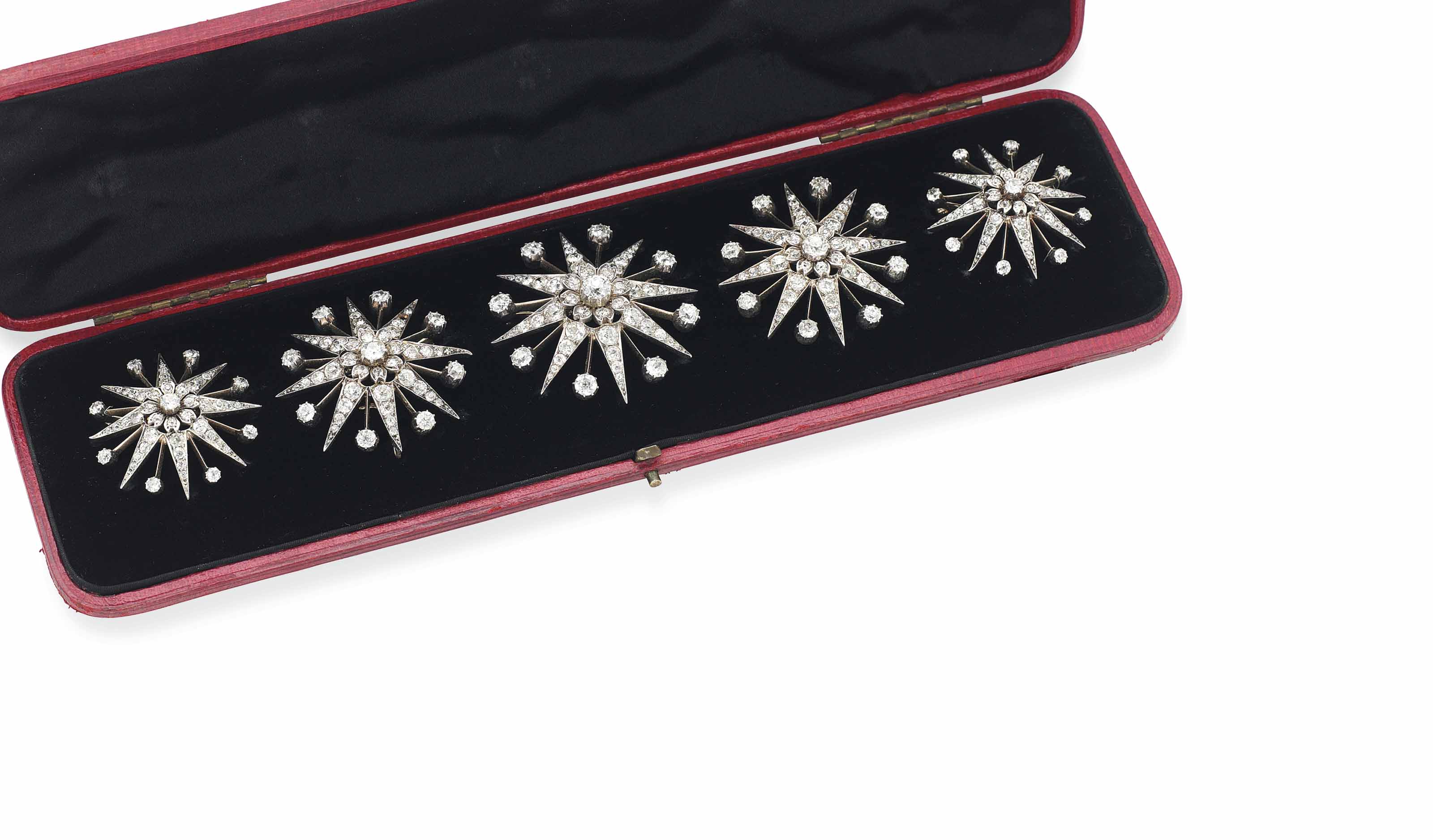 A SET OF FIVE VICTORIAN DIAMOND-SET STAR BROOCHES