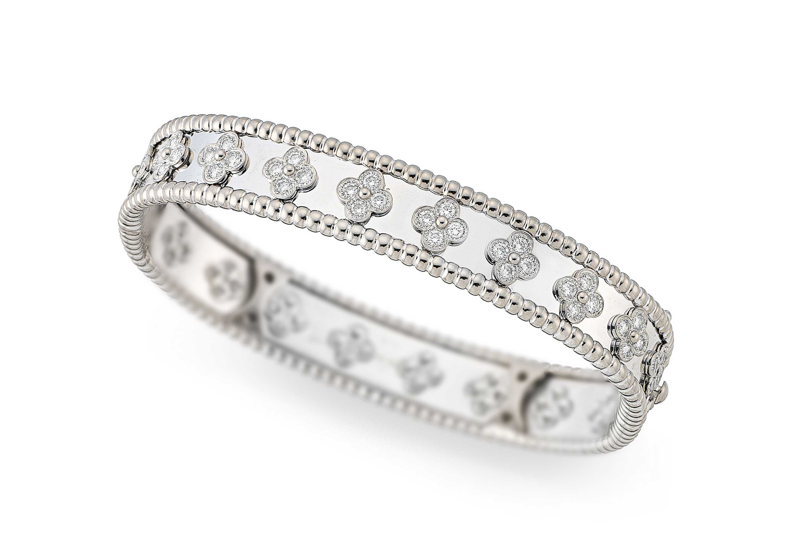 A Diamond Set Perlee Clover Bangle By Van Cleef Arpels