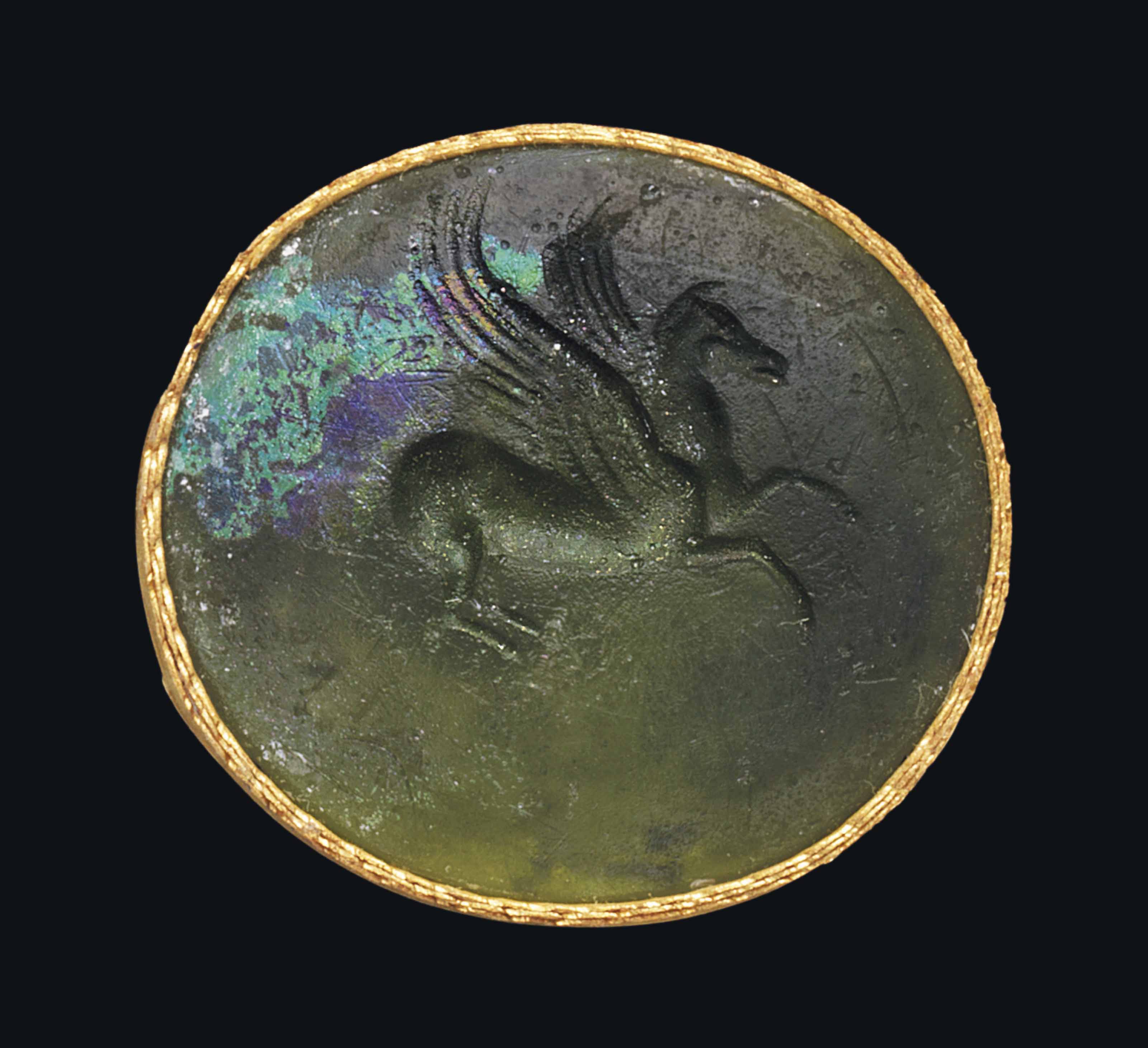 A ROMAN GREEN GLASS INTAGLIO WITH PEGASUS , CIRCA 2714 B.C. Christie's