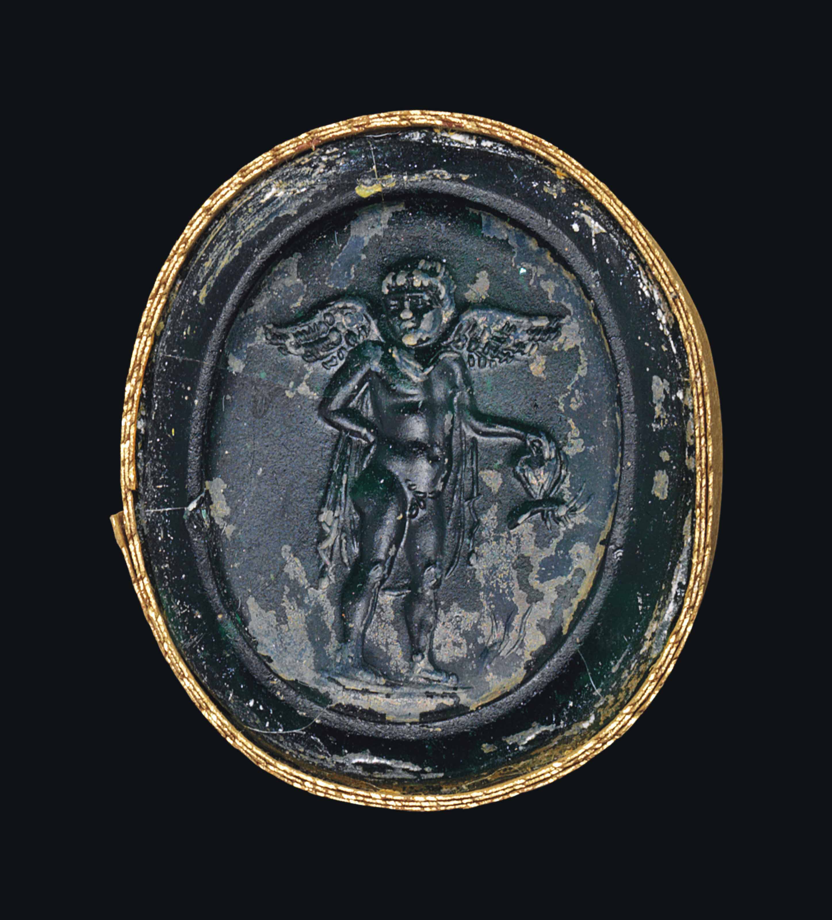 A ROMAN GREEN GLASS INTAGLIO WITH EROS , CIRCA LATE 1ST CENTURY B.C.EARLY 1ST CENTURY A.D