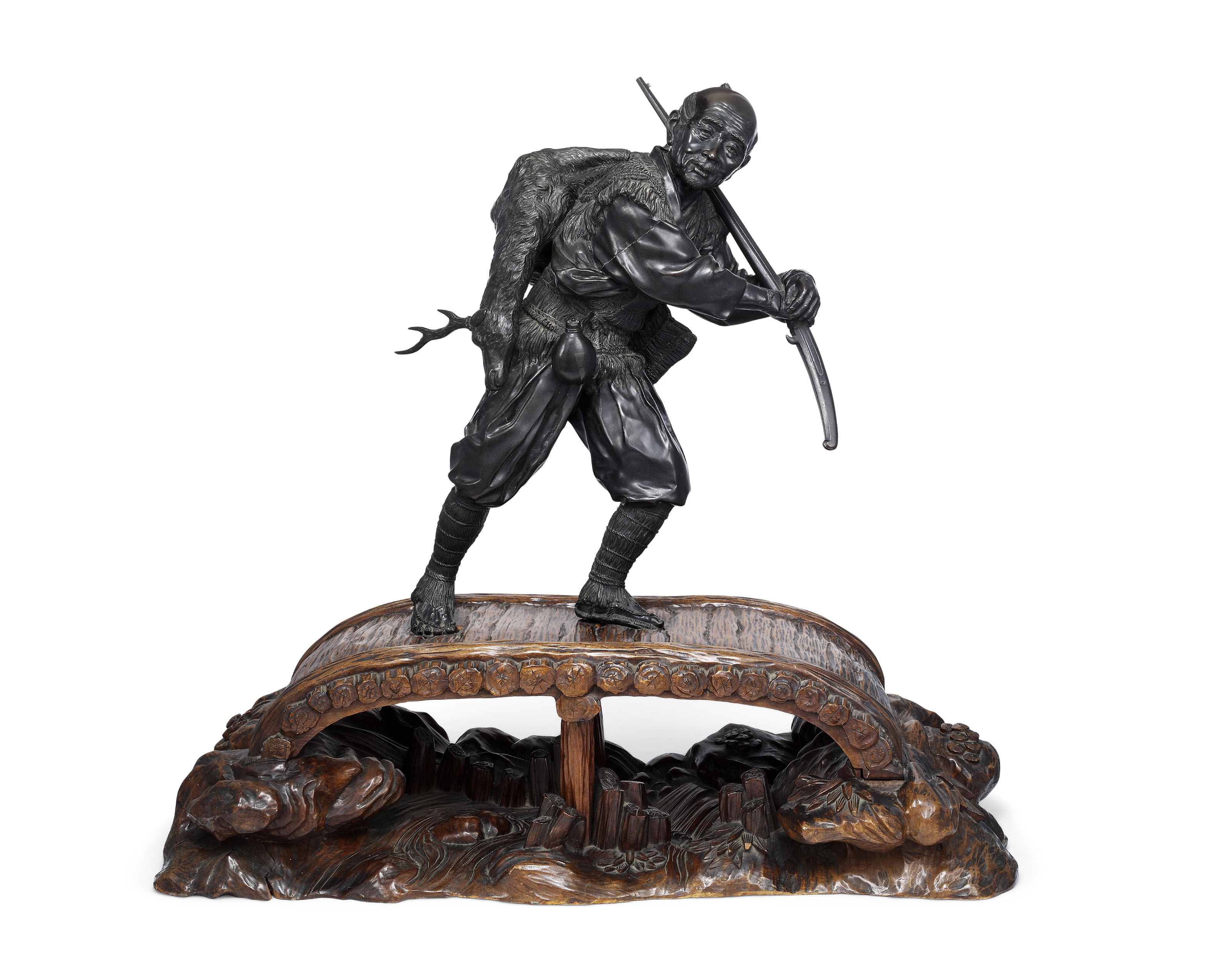 A LARGE TOKYO SCHOOL BRONZE SCULPTURE OF A HUNTER, MEIJI PERIOD