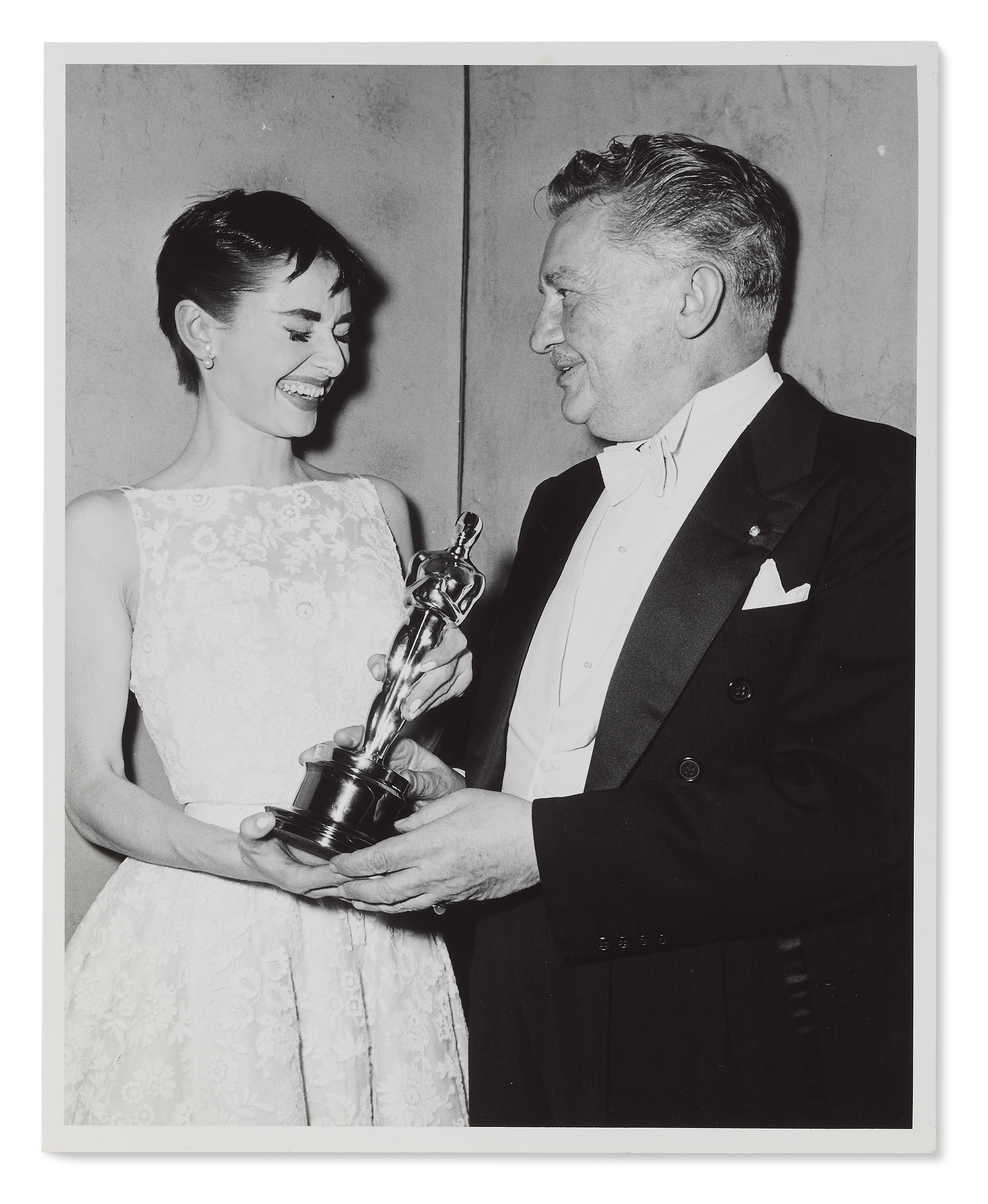 Roman Holiday, 1953 Tommy Weber, Audrey Hepburn holding her Academy Award for Best Actress for Roman Holiday with presenter Jean Hersholt at the 26th Academy Awards, New York, 25 March, 1954. Sold for &pound;4,375 on 27 September 2017 at Christie&rsquo;s in London