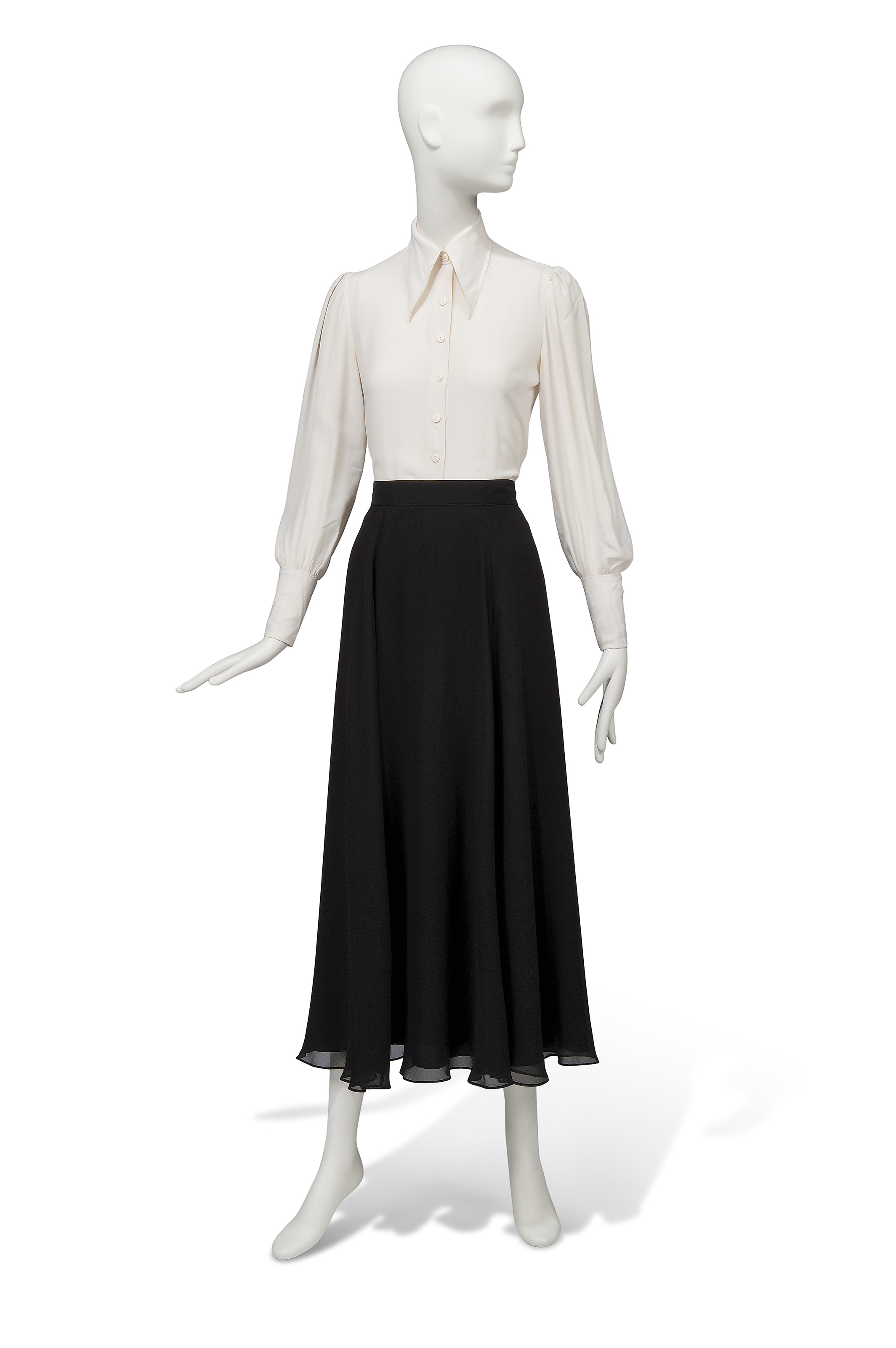 AN IVORY SILK SHIRT AND BLACK SILK SKIRT, CACHAREL AND GO SILK