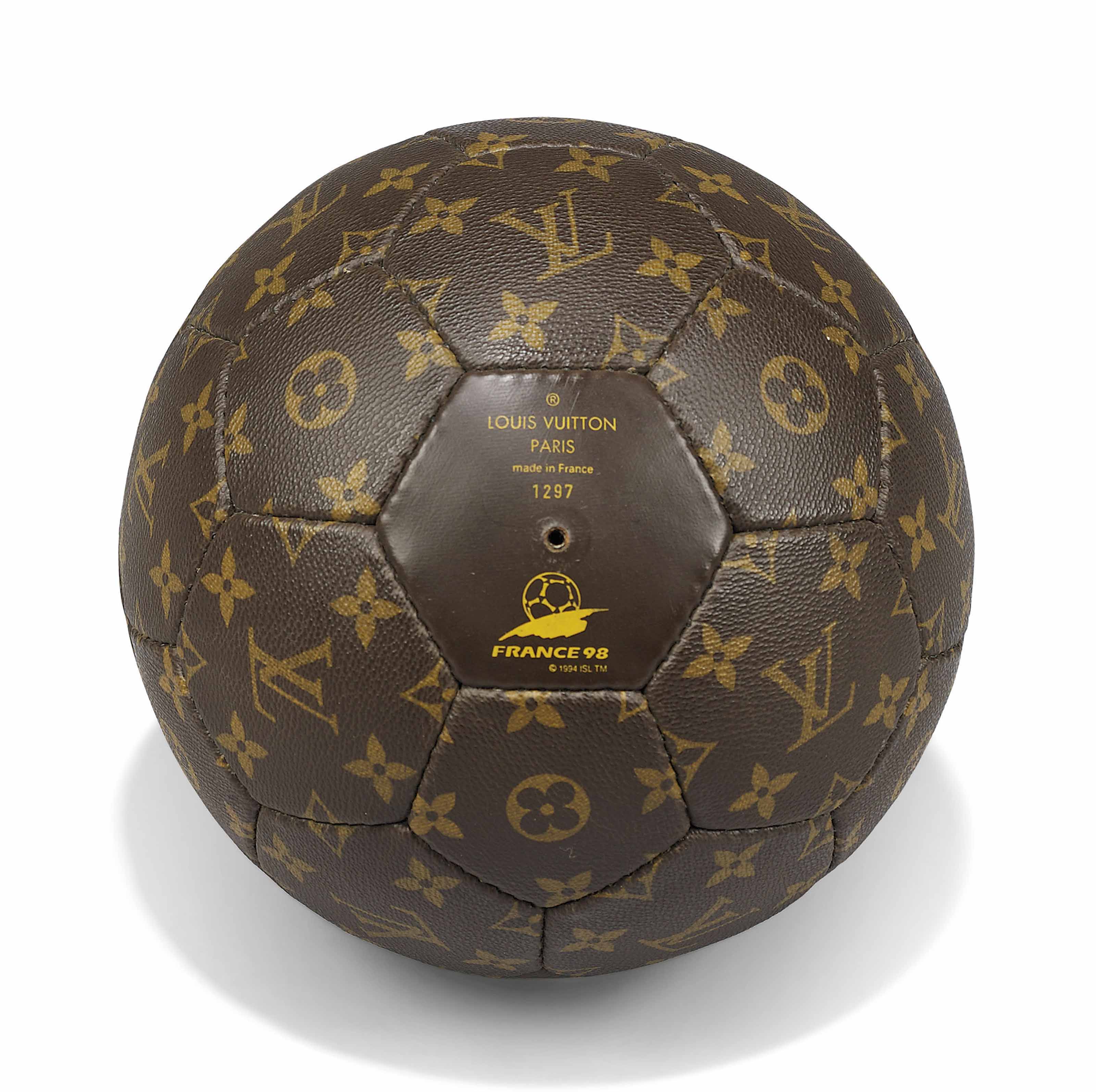 A LIMITED EDITION MONOGRAM CANVAS 1998 FRANCE WORLD CUP FOOTBALL WITH NOMADE LEATHER CARRIER ...