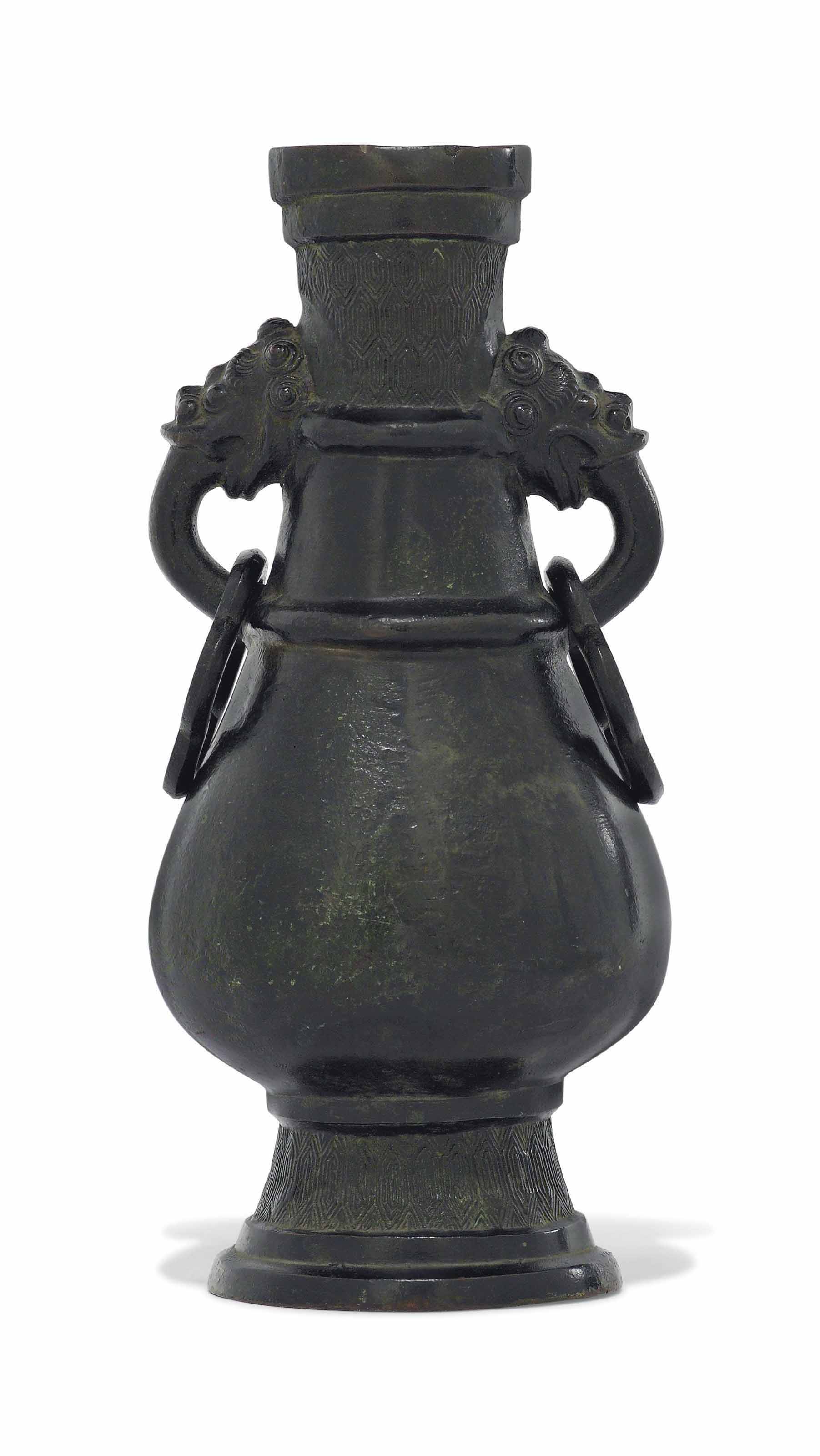 A CHINESE ARCHAISTIC BRONZE PEARSHAPED TWOHANDLED VASE , MING DYNASTY