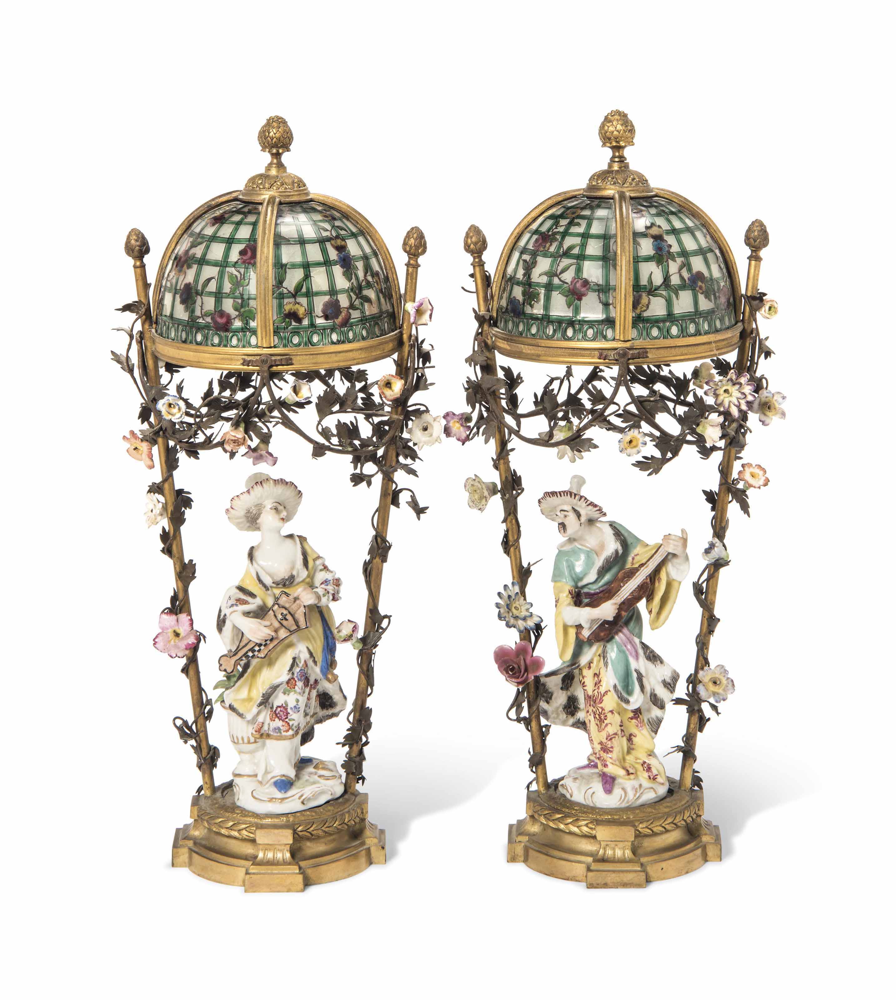 A PAIR OF FRENCH ORMOLU, PAINTED GLASS AND PORCELAIN FIGURAL LAMPS