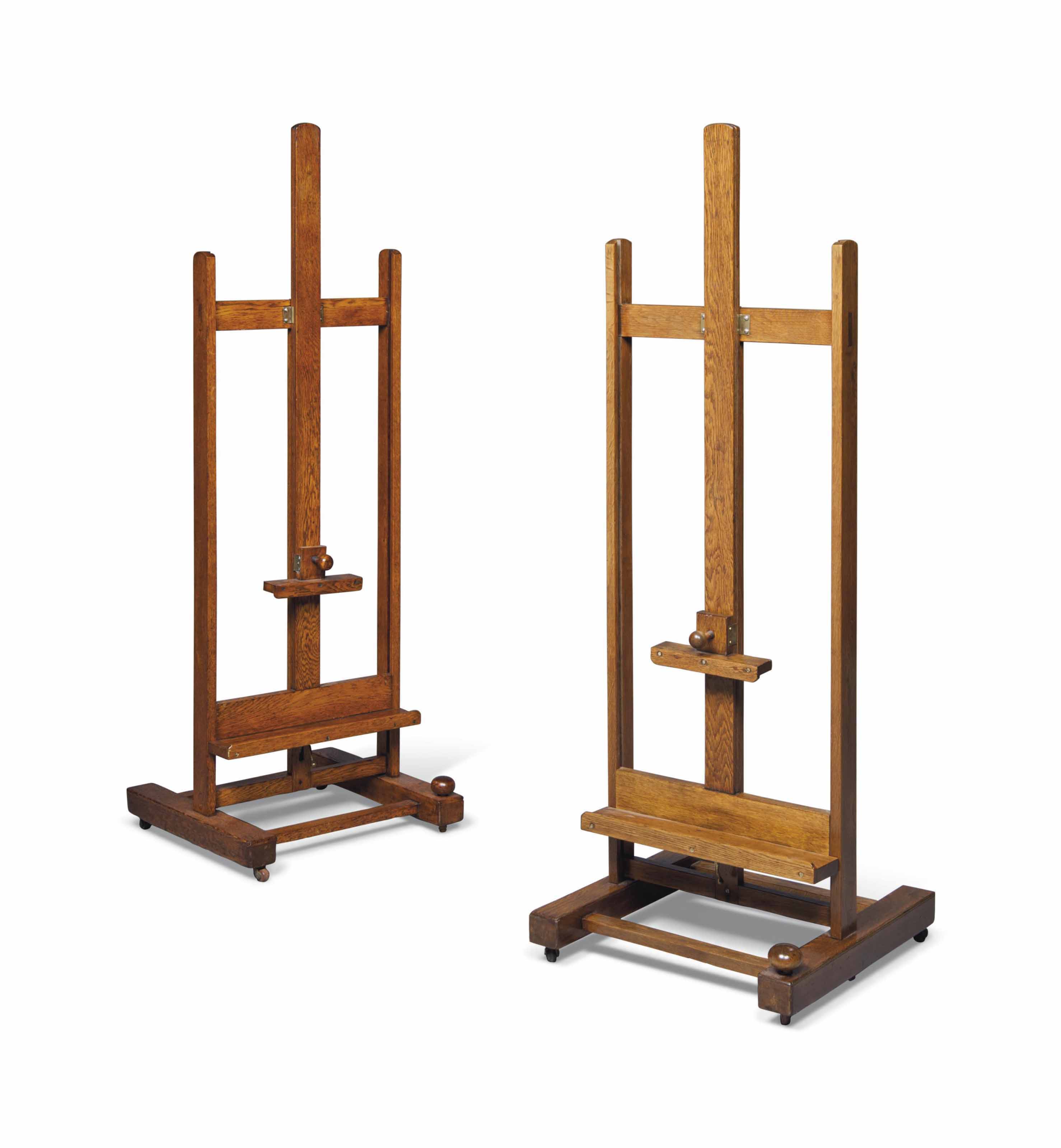 A NEAR PAIR OF VICTORIAN OAK ARTIST'S EASELS OF ADJUSTABLE HEIGHT , BY