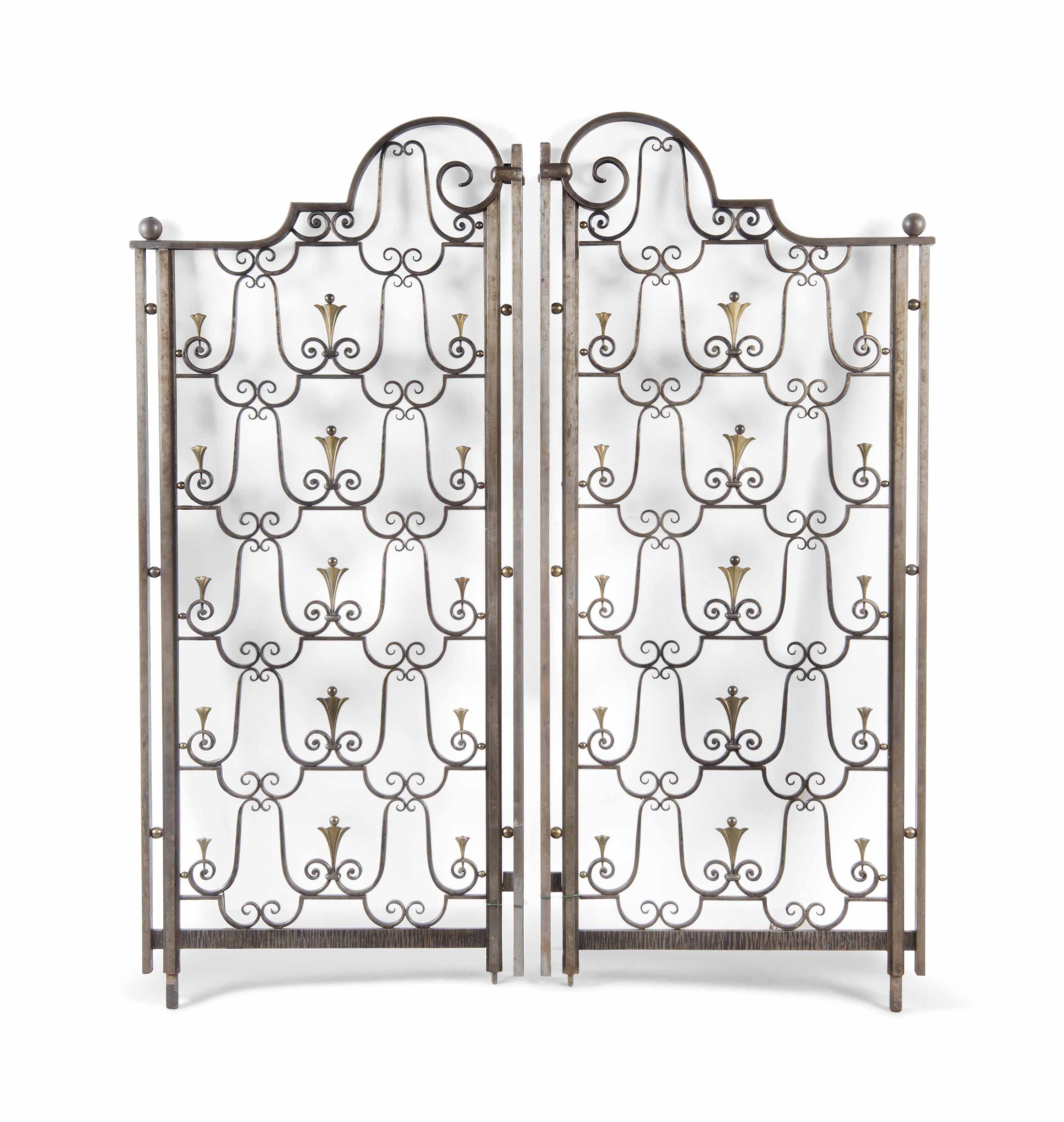 A PAIR OF FRENCH WROUGHTIRON AND BRONZE ROOM DIVIDERS BY CHARLES