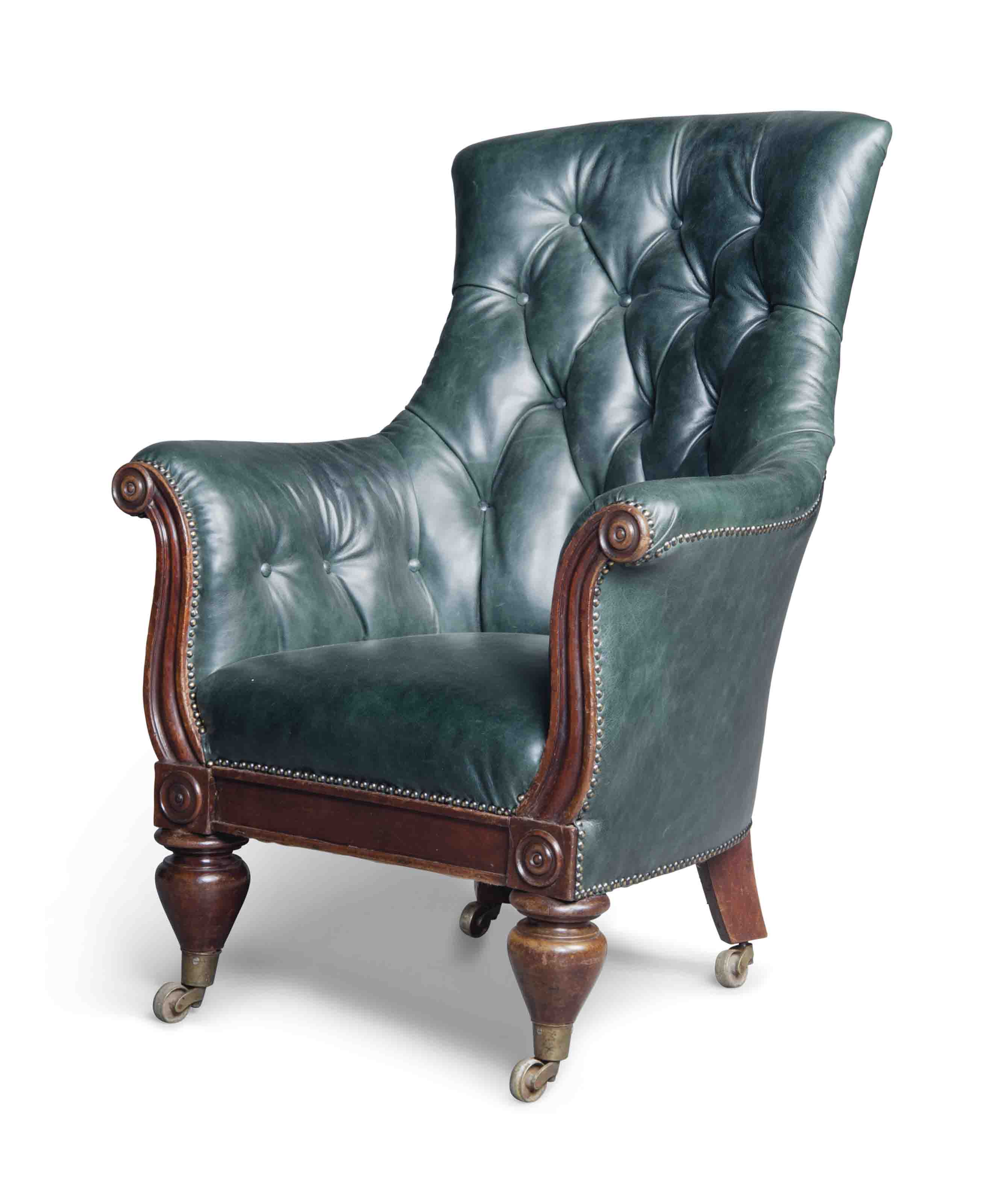 AN EARLY VICTORIAN MAHOGANY AND BUTTONED LEATHER LIBRARY CHAIR , MID