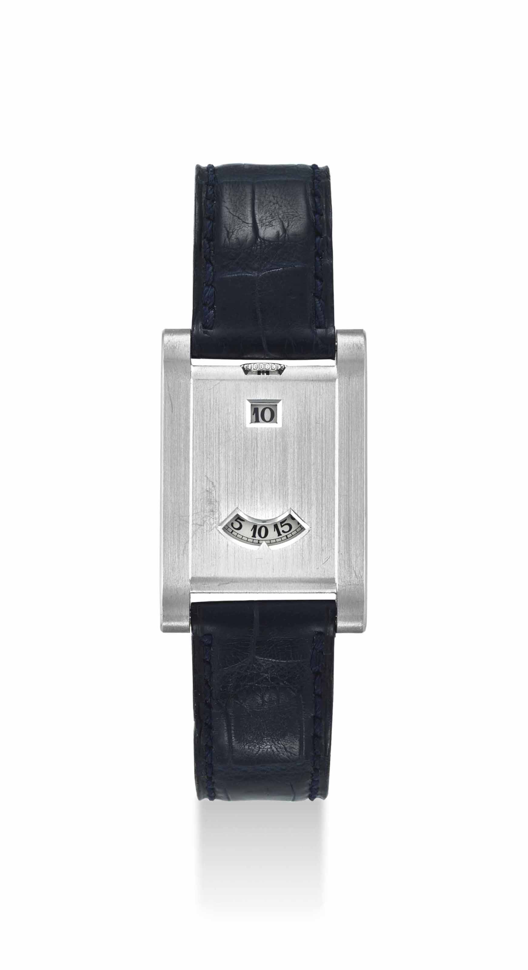 CARTIER. A VERY FINE AND RARE PLATINUM LIMITED EDITION JUMP HOUR WRISTWATCH SIGNED CARTIER PARIS TANK A GUICHET MODEL NO. 001 3 CASE NO. A113720 MANUFACTURED IN 1996 Christie s