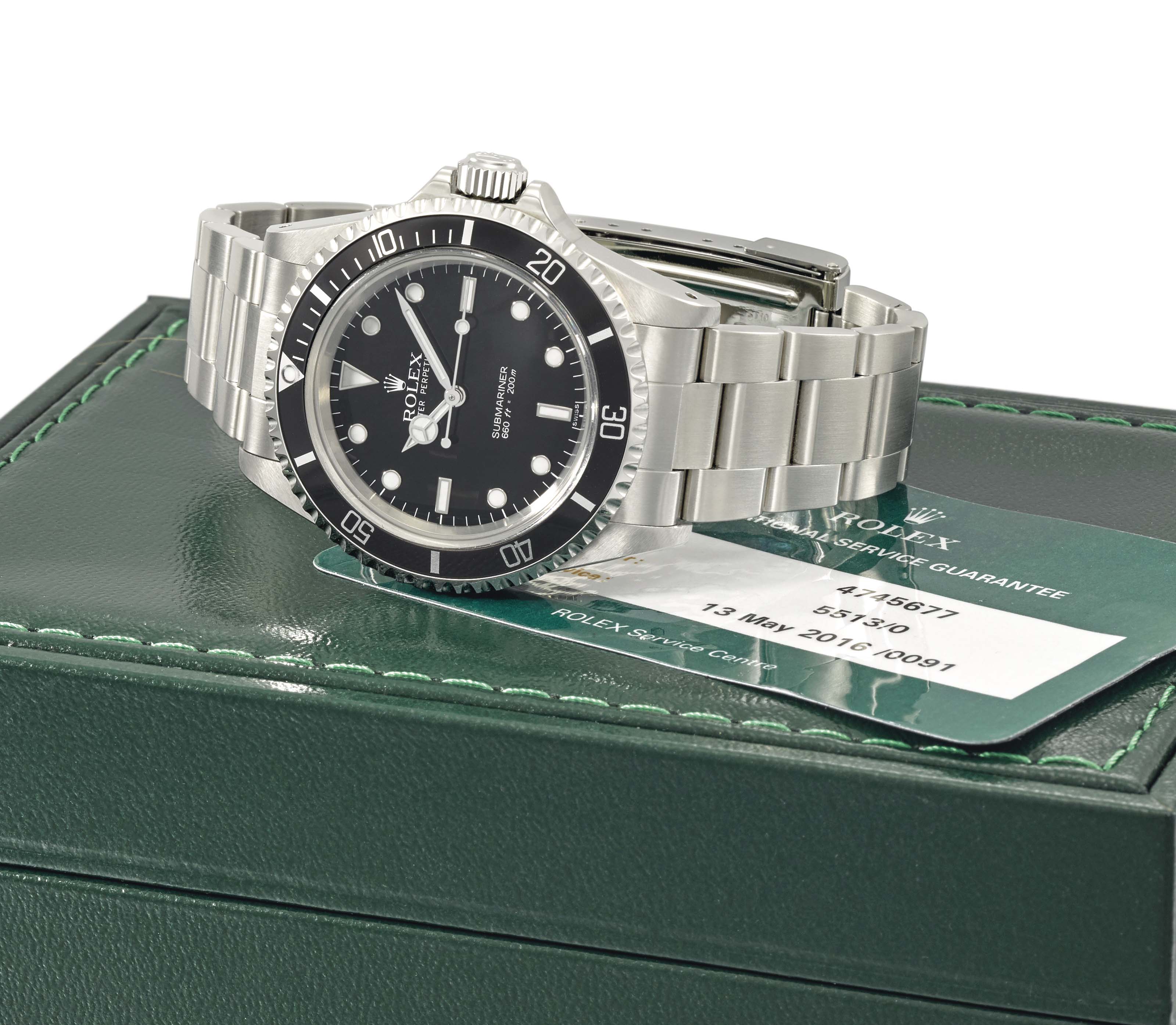 Rolex. A fine 18K white gold dual time annual calendar wristwatch with  sweep centre seconds