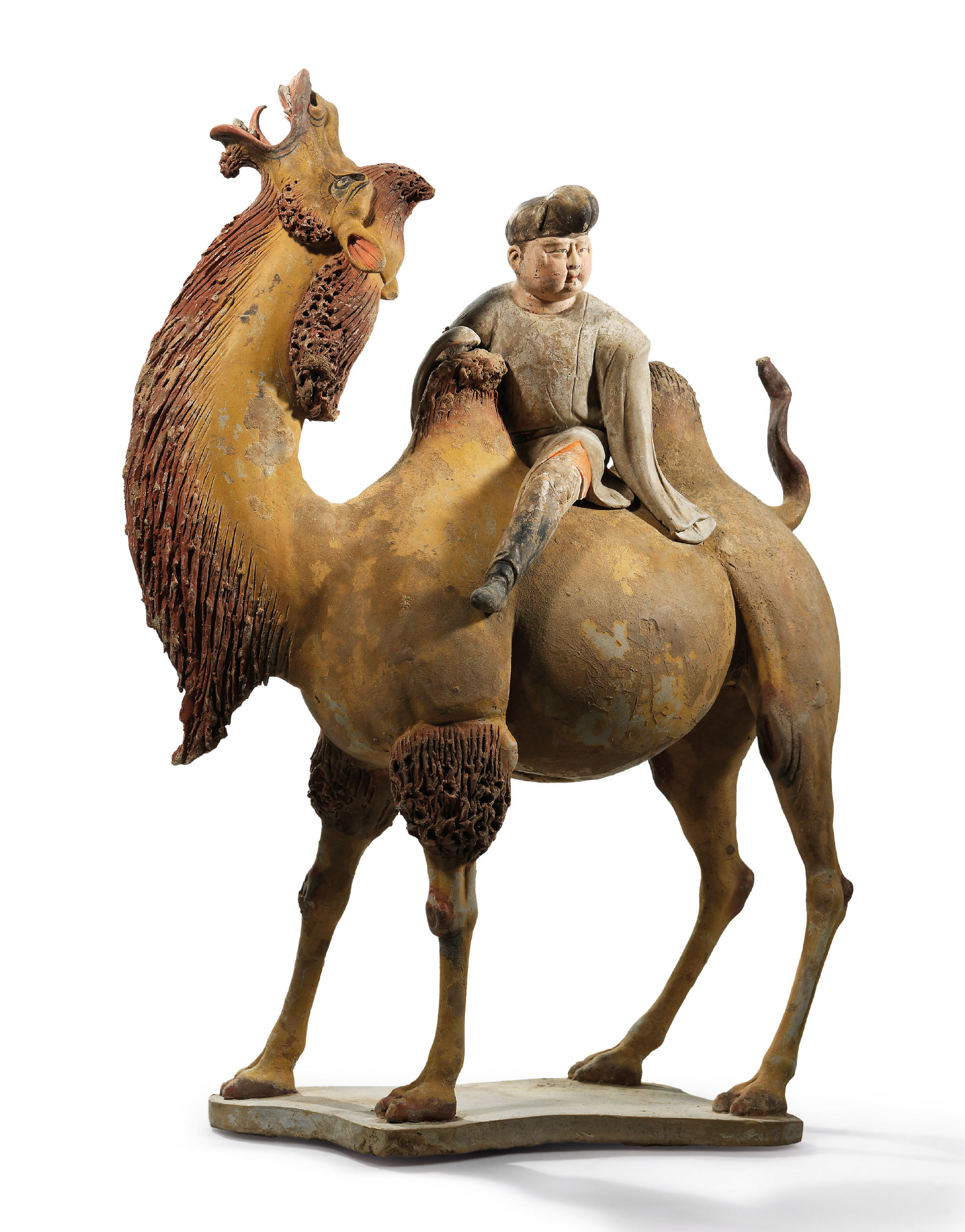 A FINELY PAINTED POTTERY FIGURE OF A BACTRIAN CAMEL AND ...
