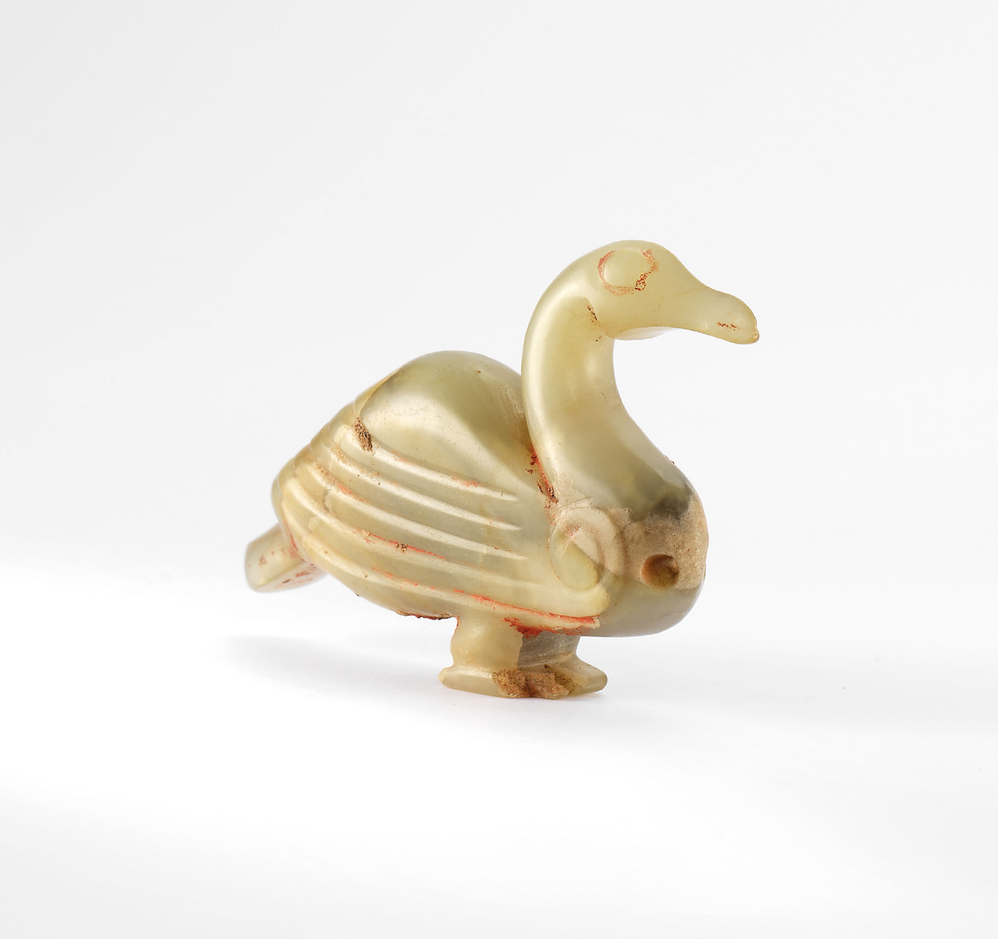 A CELADON JADE 'GOOSE' PENDANT , LATE SHANG DYNASTY, CIRCA 12THMID