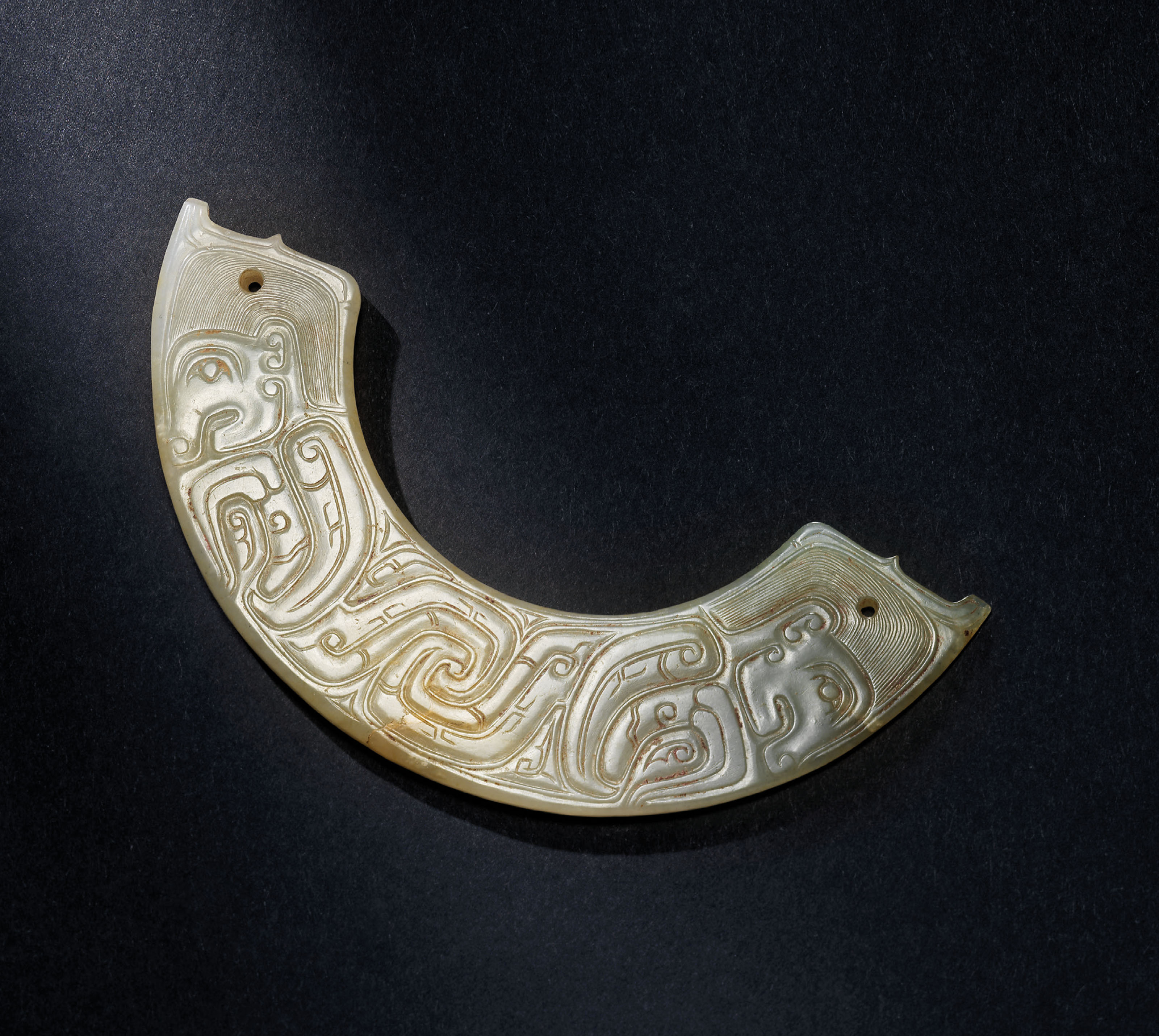 A VERY RARE WHITE JADE ‘HUMAN FIGURE’ ORNAMENT, HUANG , WESTERN ZHOU DYNASTY (C. 1100771 BC