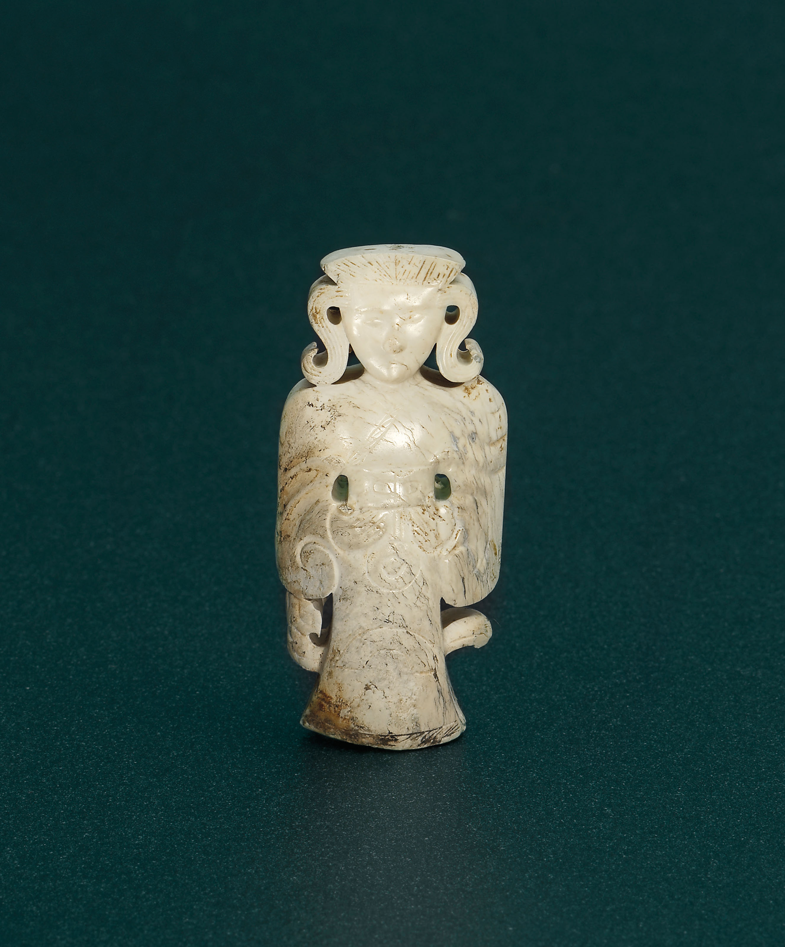 A JADE STANDING FIGURE , LATE WARRING STATES PERIOD TO EARLY WESTERN