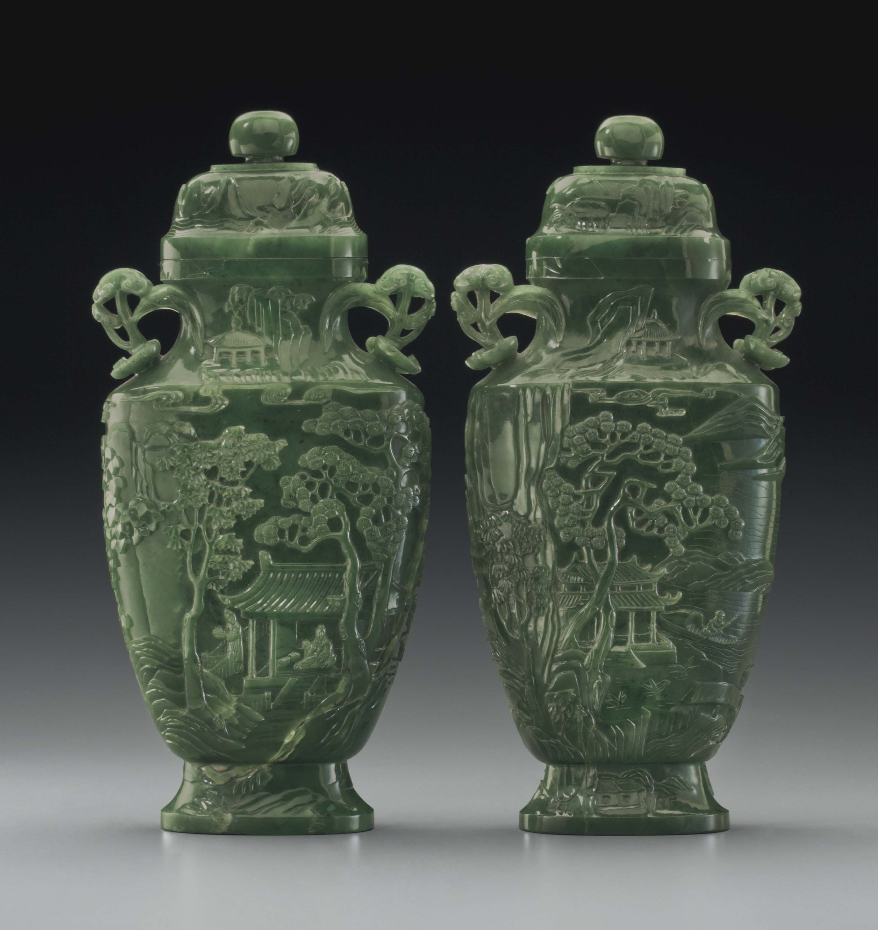A PAIR OF SPINACHGREEN JADE VASES AND COVERS