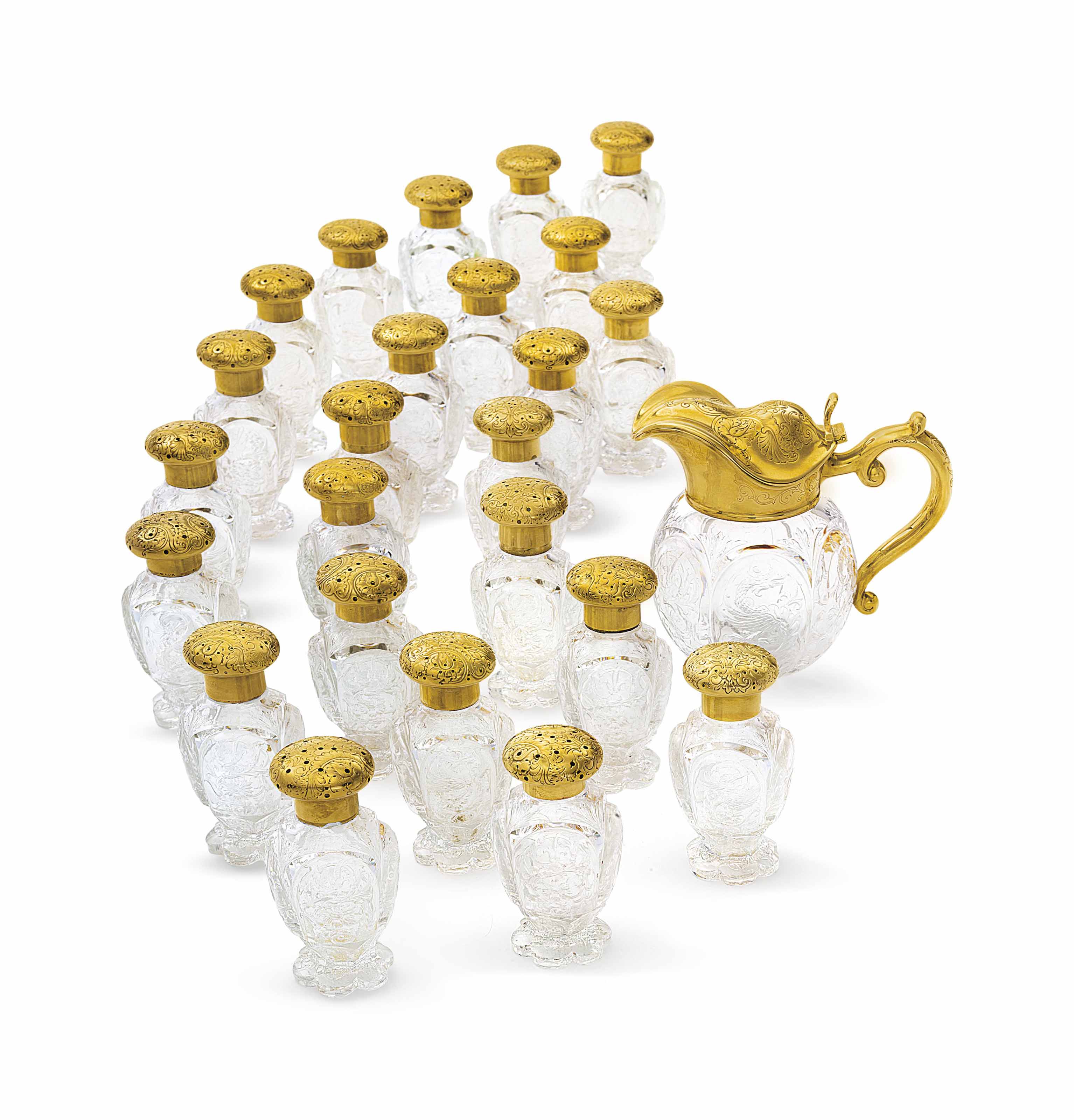 AN EXTENSIVE 18KARAT GOLDMOUNTED COLORLESS GLASS SALT AND PEPPER SET
