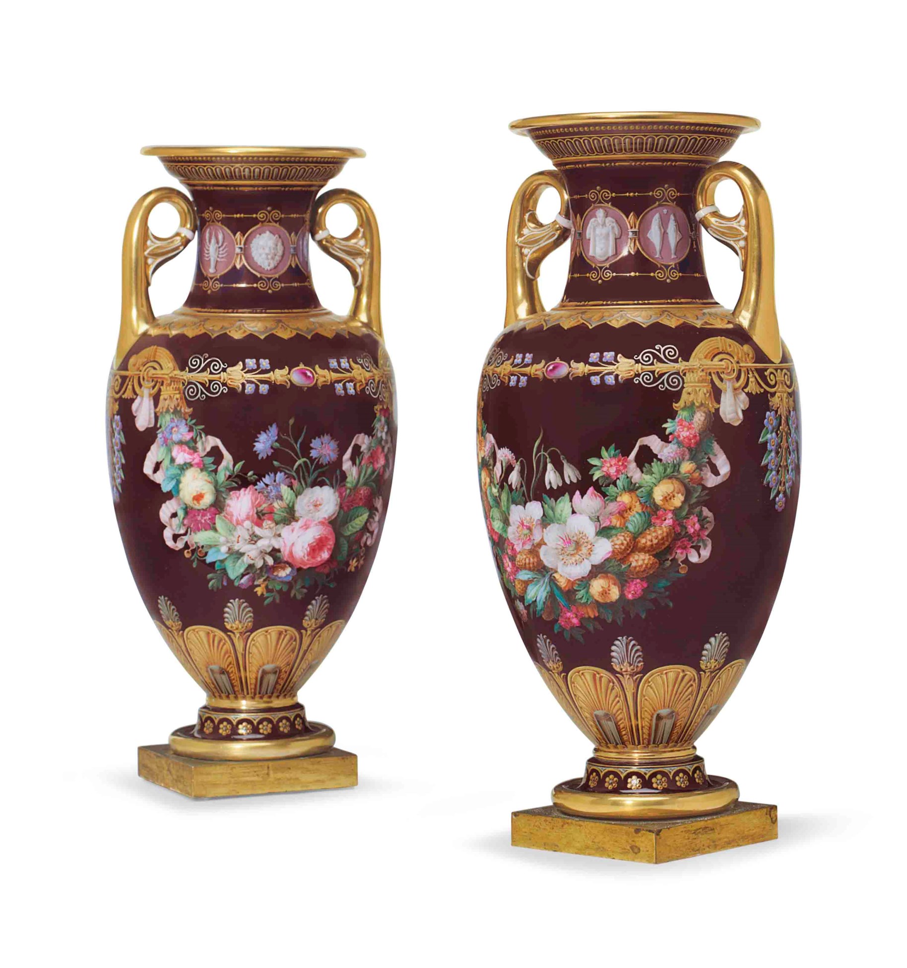 A PAIR OF ORMOLUMOUNTED SEVRES PORCELAIN BURGUNDYGROUND VASES (VASES