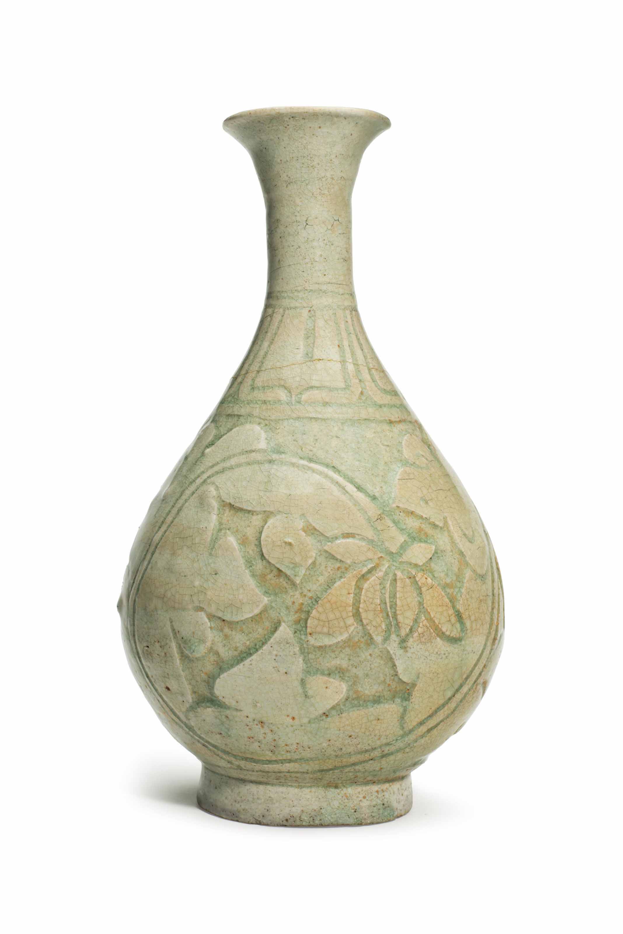 A CHINESE CELADONGLAZED CARVED BOTTLE VASE , YUAN DYNASTY OR LATER