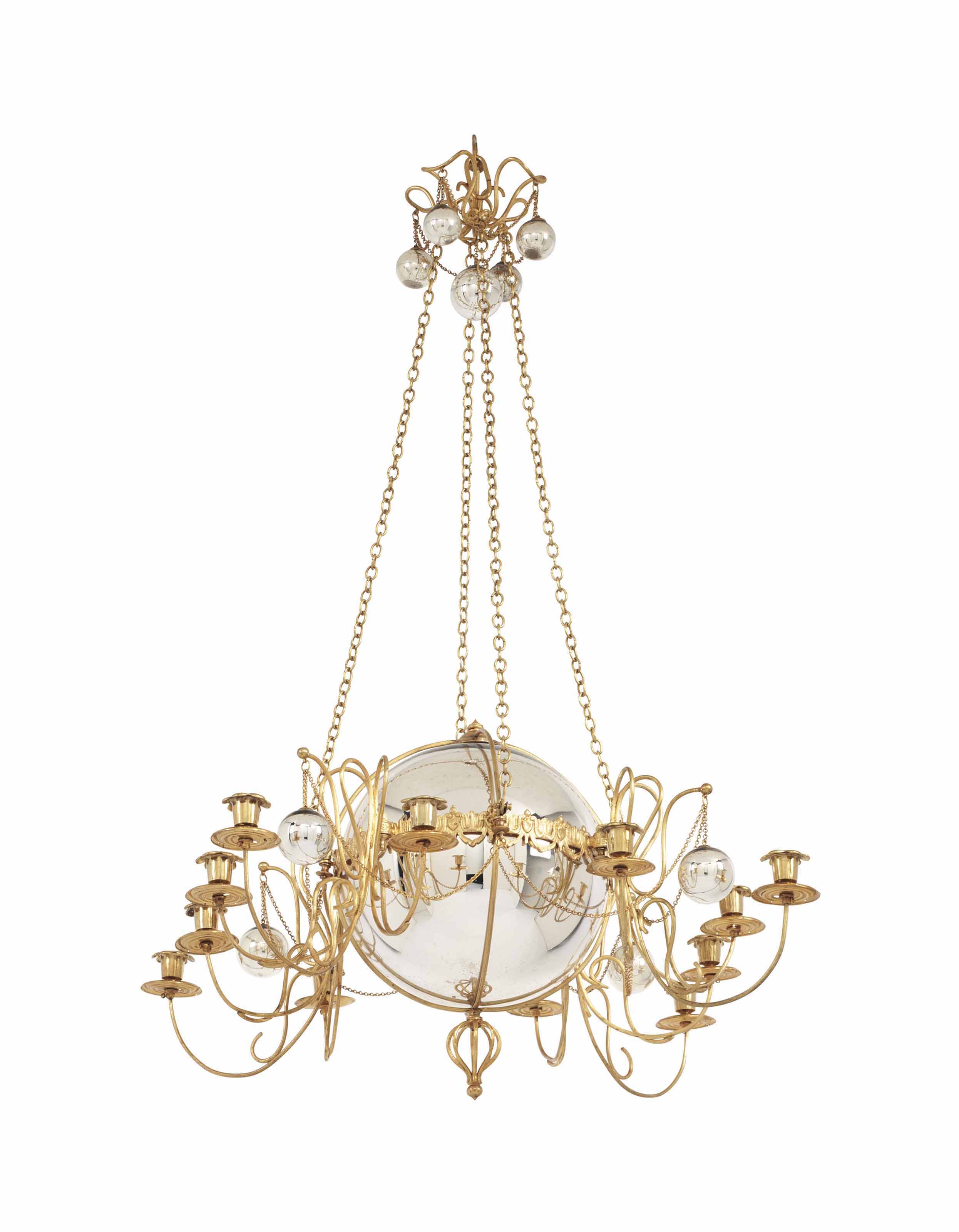 A GILT METAL AND MERCURY GLASS TWELVE LIGHT CHANDELIER ...