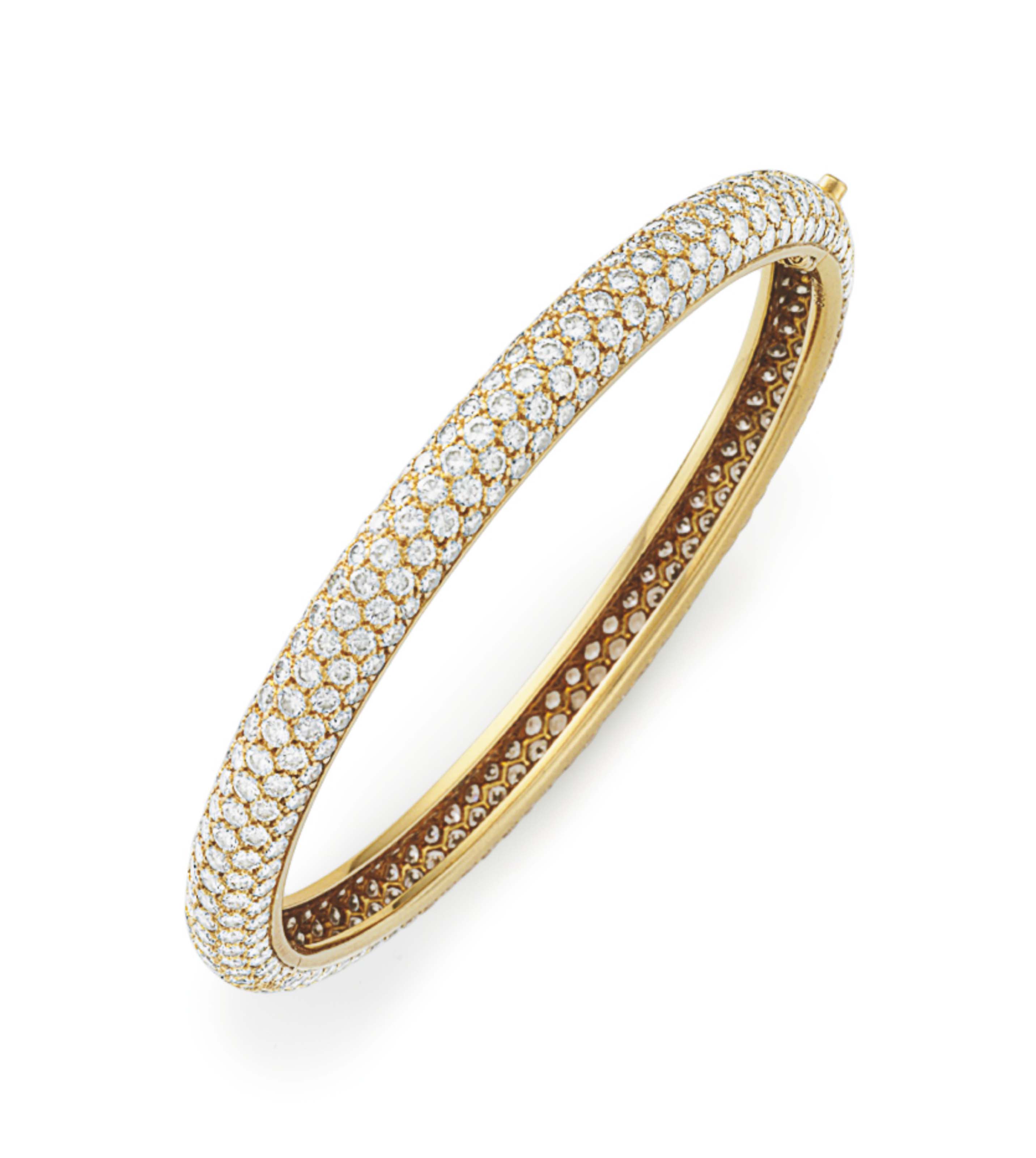 A DIAMOND BANGLE BRACELET, BY CARTIER