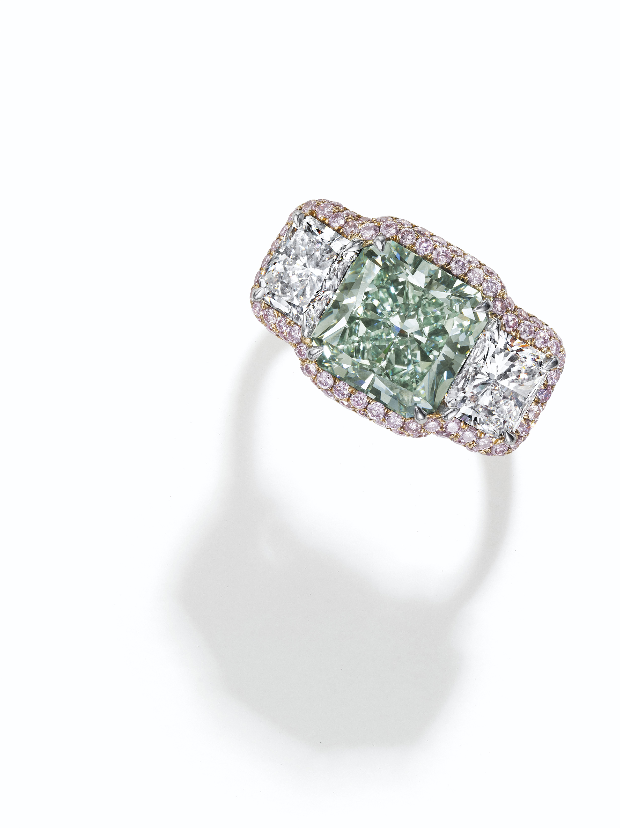 A RARE COLORED DIAMOND AND DIAMOND RING | Christie's