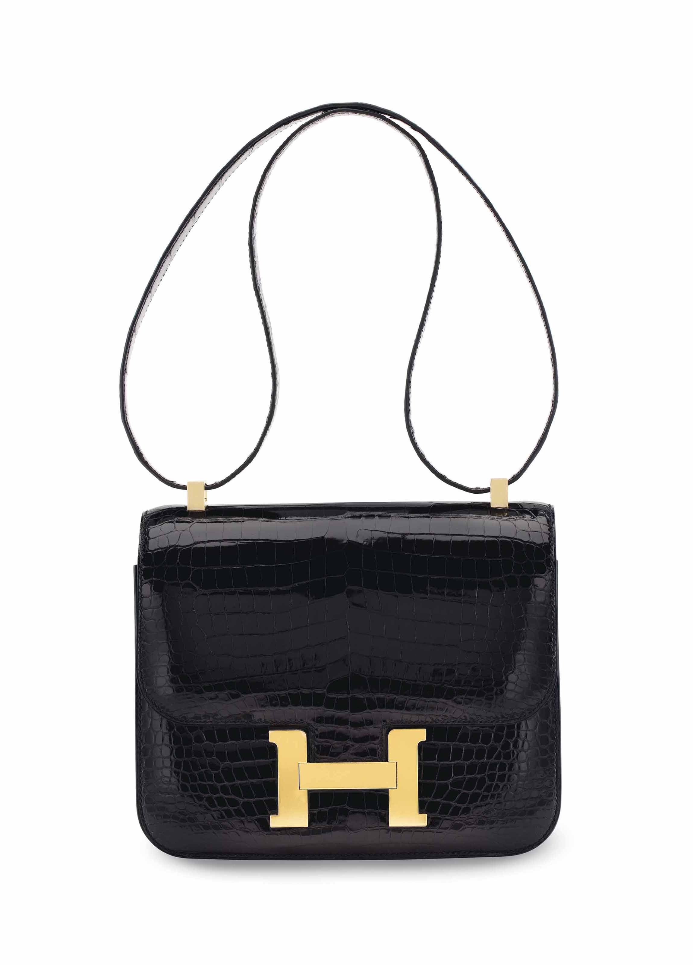 A SHINY BLACK POROSUS CROCODILE CONSTANCE 24 WITH GOLD HARDWARE