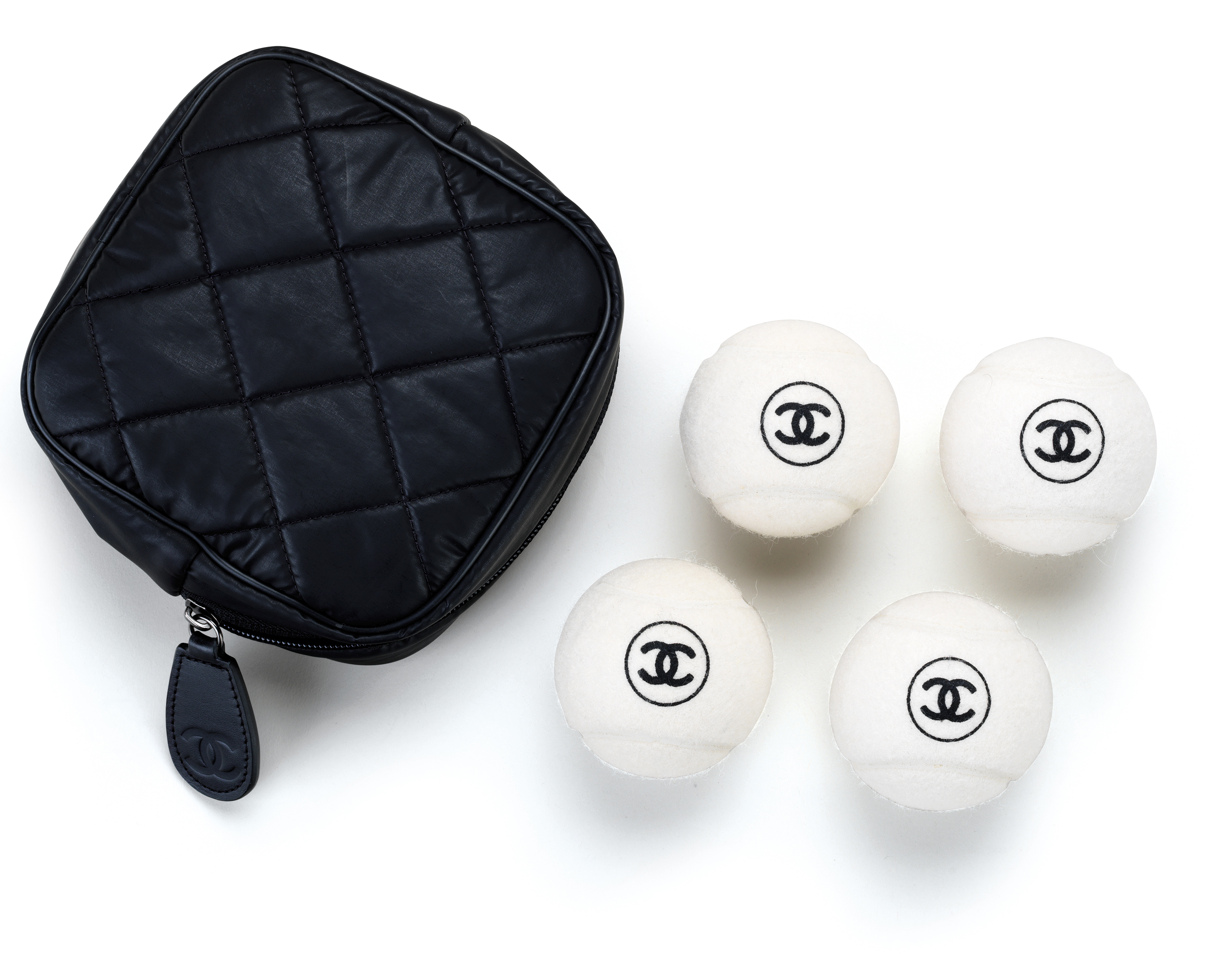 A SET OF FOUR WHITE TENNIS BALLS, CHANEL, 2010s Christie’s